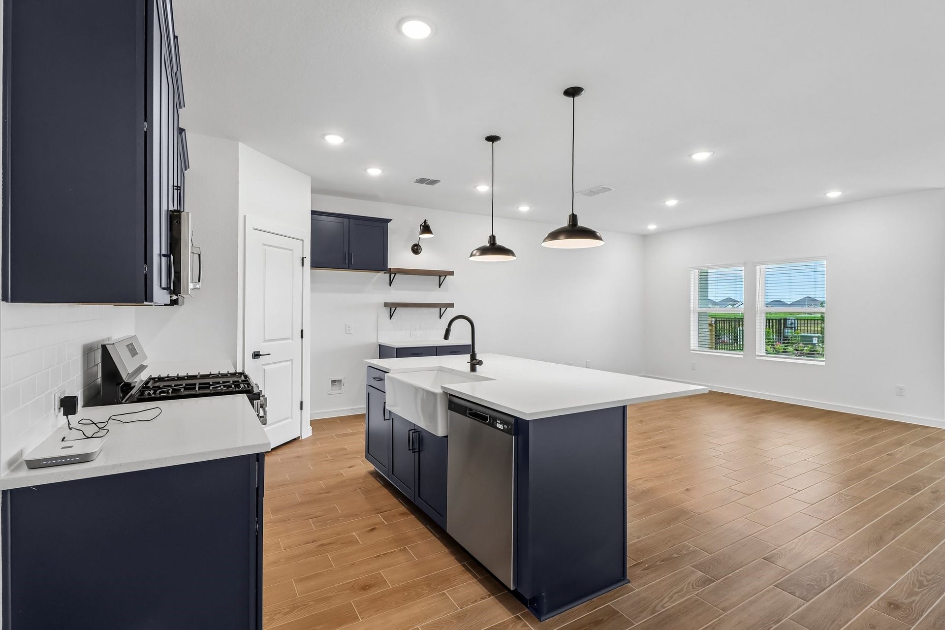 Stylish kitchen with blue cabinets and quartz counters