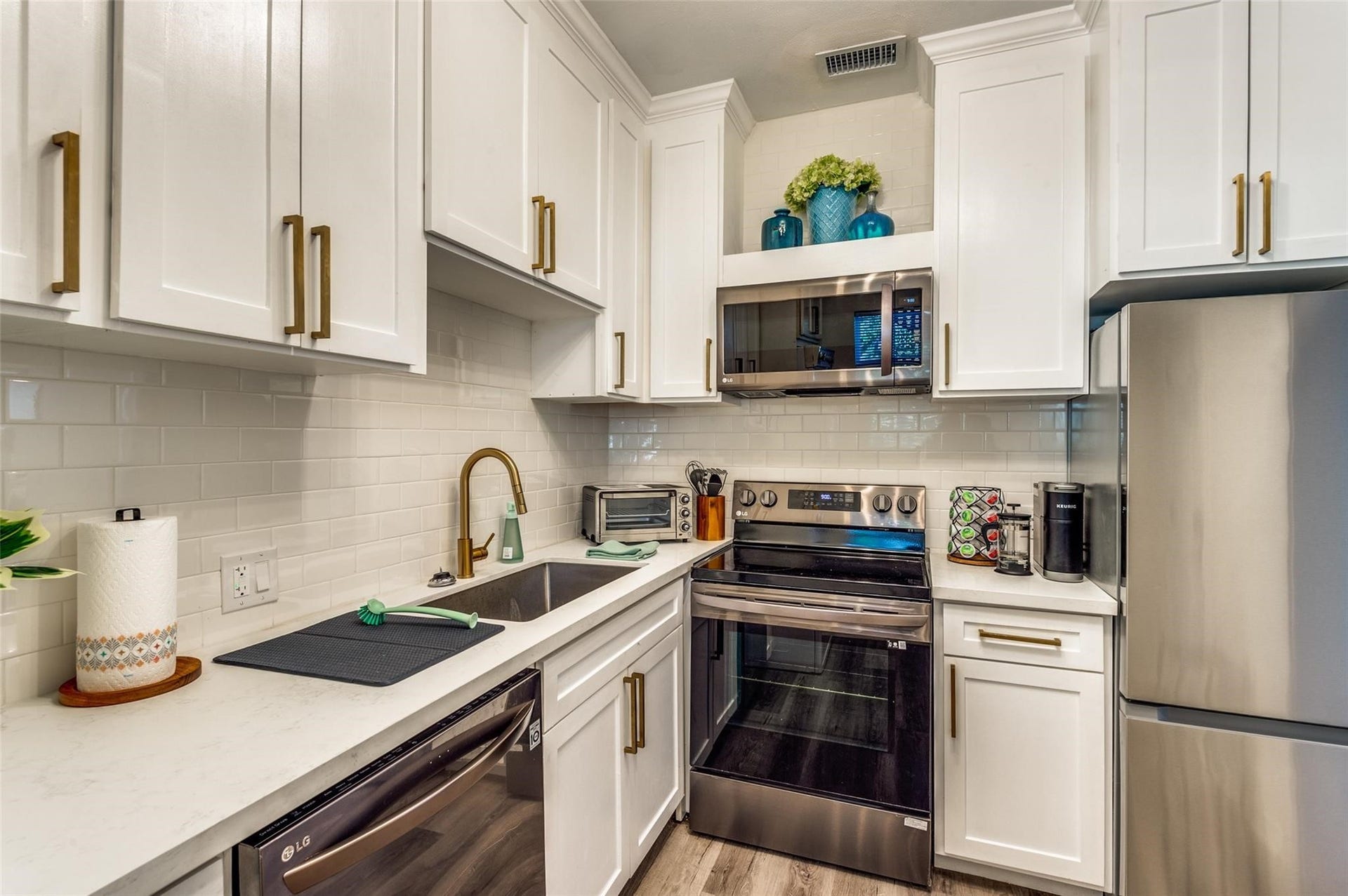 2410 Truxillo Street, #Unit C, Houston, TX 77004 Updated Kitchen with white cabinetry and stainless steel appliances