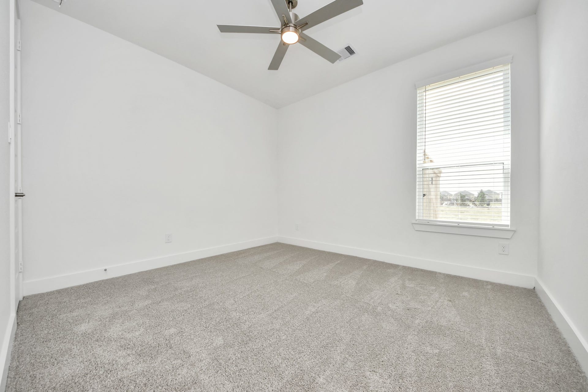 Generously sized secondary bedrooms featuring spacious closets, soft and inviting carpeting underfoot, large windows allowing plenty of natural light, and the added touch of privacy blinds for your personal retreat. Sample photo of completed home with similar floor plan. Actual colors and selections may vary.