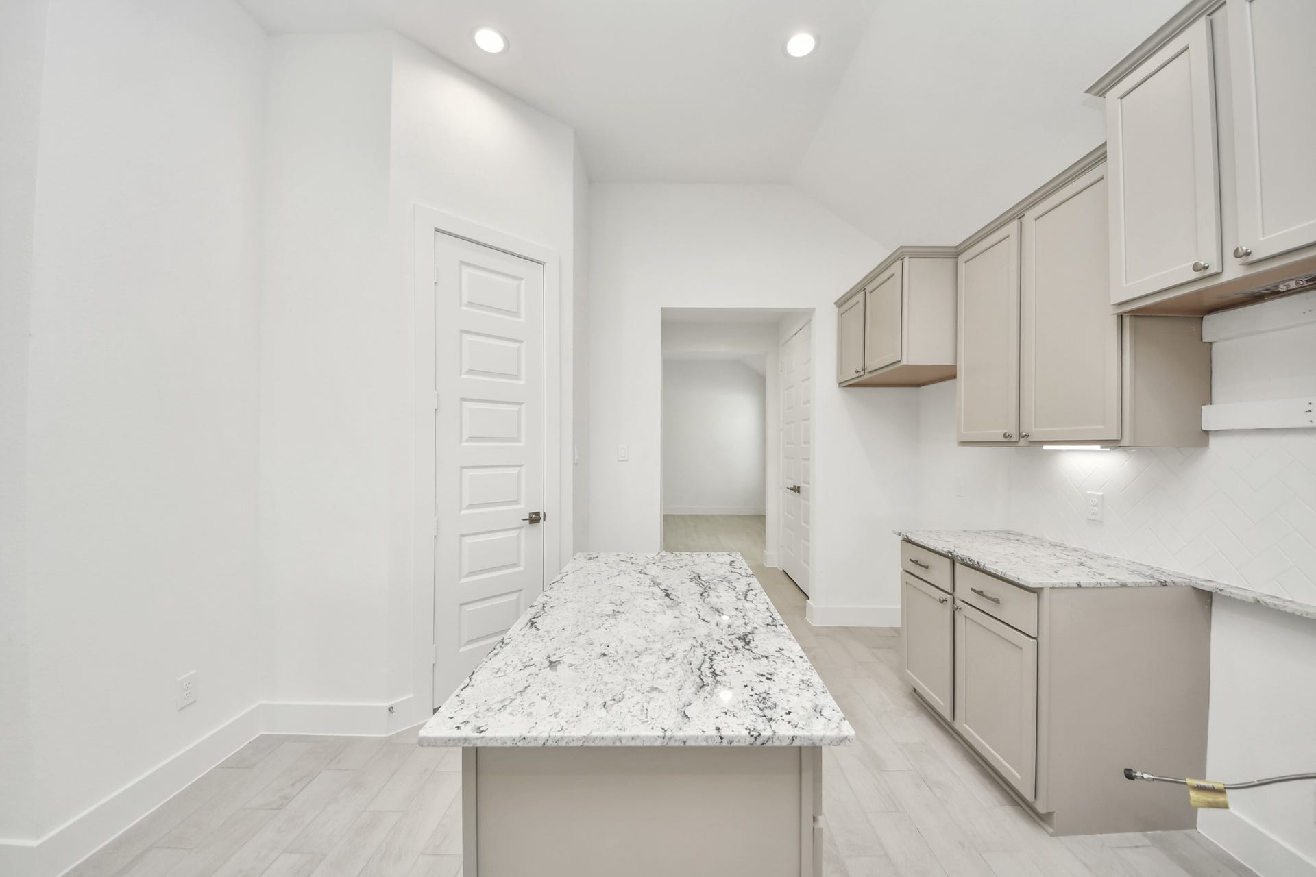 This generously spacious kitchen is a dream realized! Sample photo of completed home with similar floor plan. Actual colors and selections may vary.