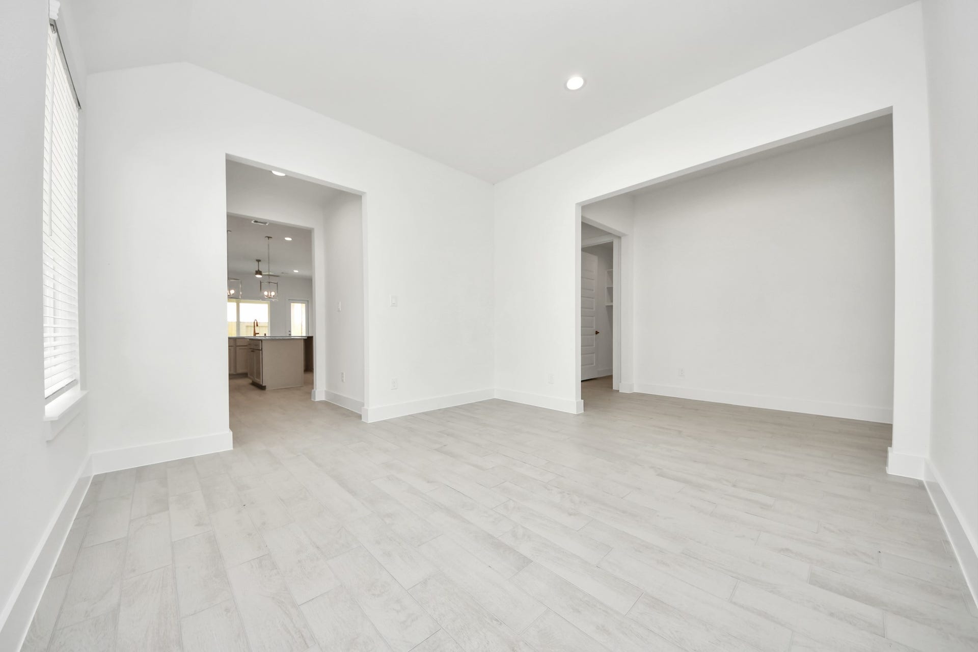 Make memories gathered around the table with your family and friends! This spacious dining room features elegant flooring, custom paint, and adjacent to family room and kitchen for open concept feel. Sample photo of completed home with similar floor plan. Actual colors and selections may vary.