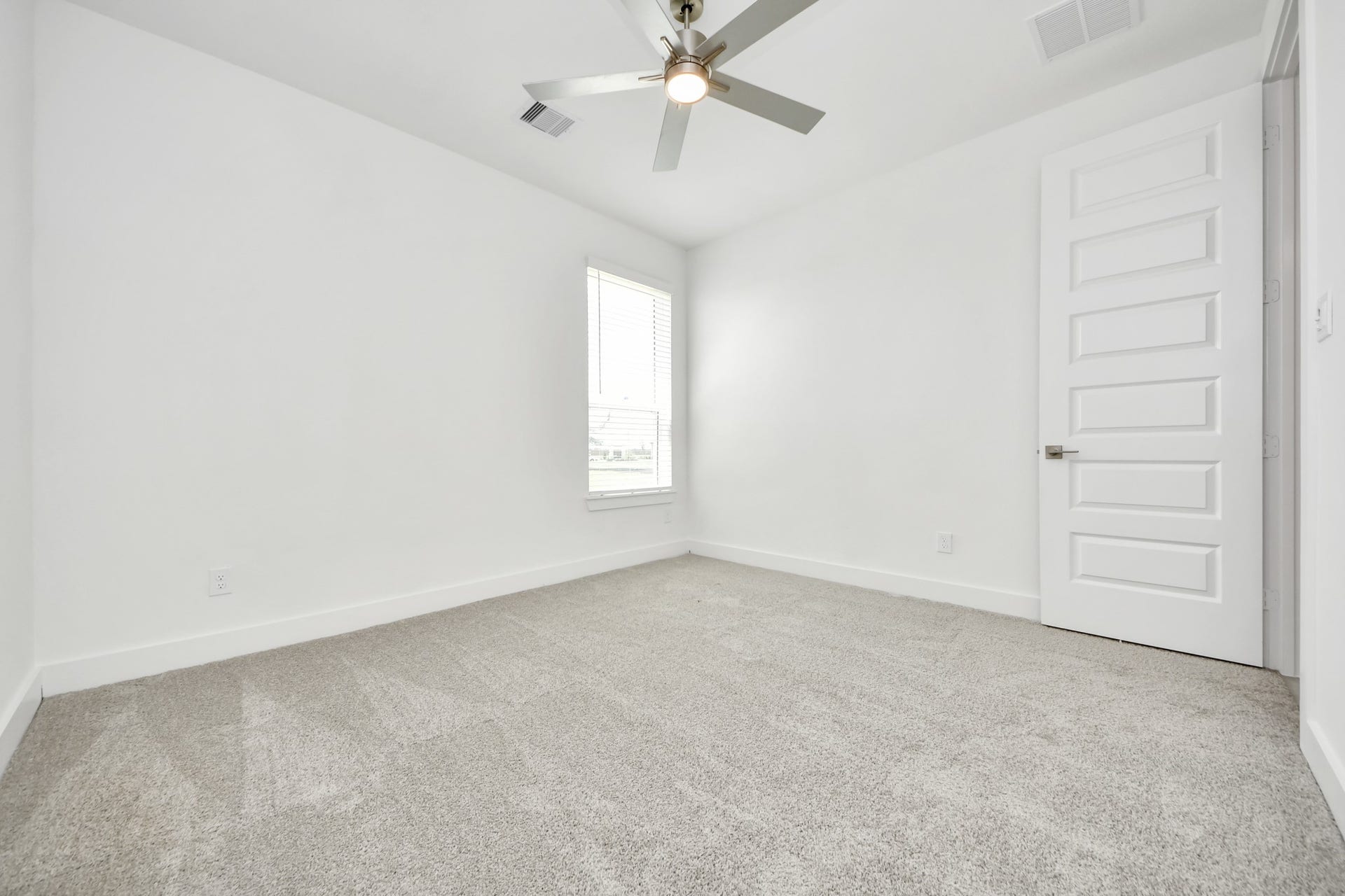 Generously sized secondary bedrooms featuring spacious closets, soft and inviting carpeting underfoot, large windows allowing plenty of natural light, and the added touch of privacy blinds for your personal retreat. Sample photo of completed home with similar floor plan. Actual colors and selections may vary.
