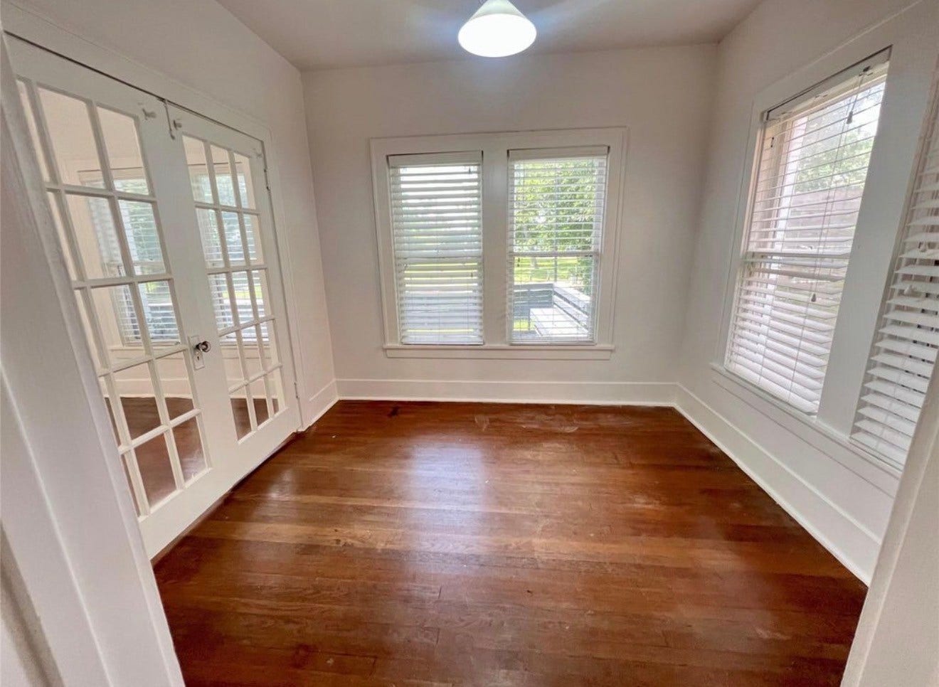 Double doors lead to a flex room that would make a great home office or third bedroom.