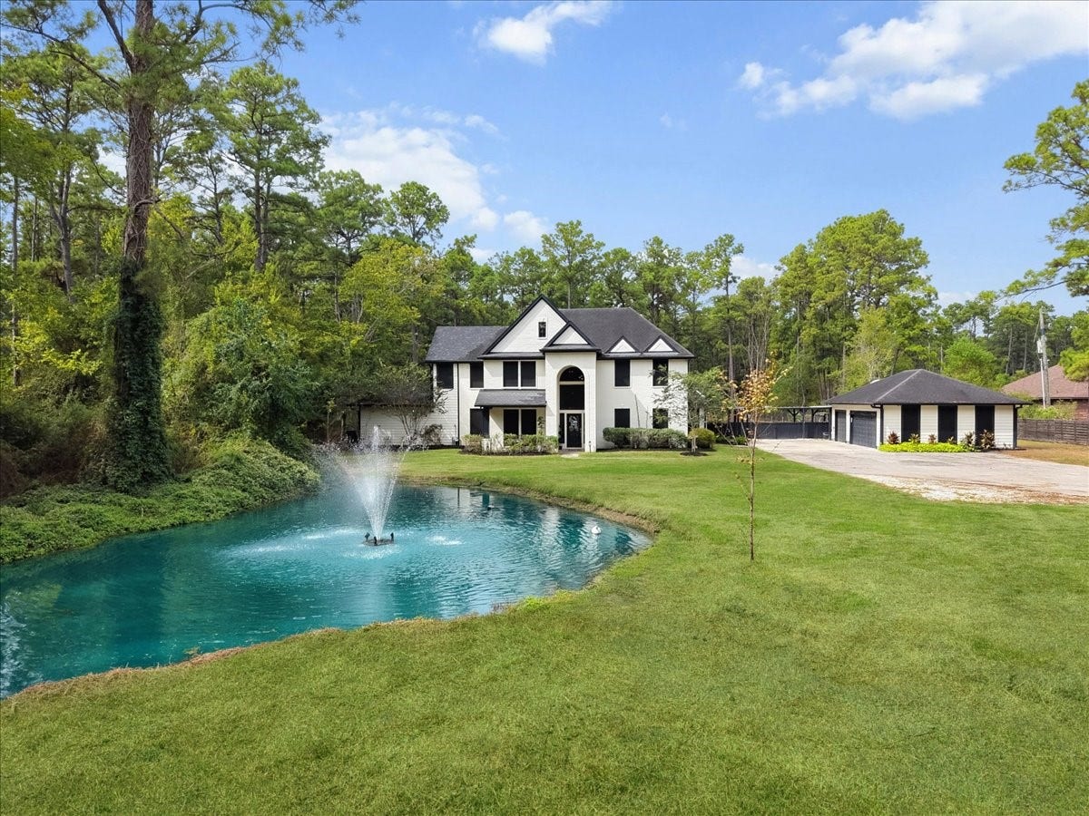 7202 Pine Drive W, Alvin, TX 77511 This updated two-story country place, features a detached 3 car garage, also foundation framed for future garage apartment. Stocked pond also has working fountains and lights