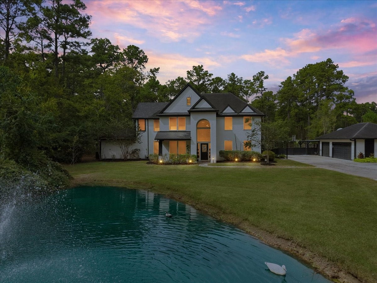 7202 Pine Drive W, Alvin, TX 77511 Sunset in the country, Front Elevation facing south in this secluded 5-acre tract, stocked pond, approximately 10' deep, backdrop of elegant two-story
