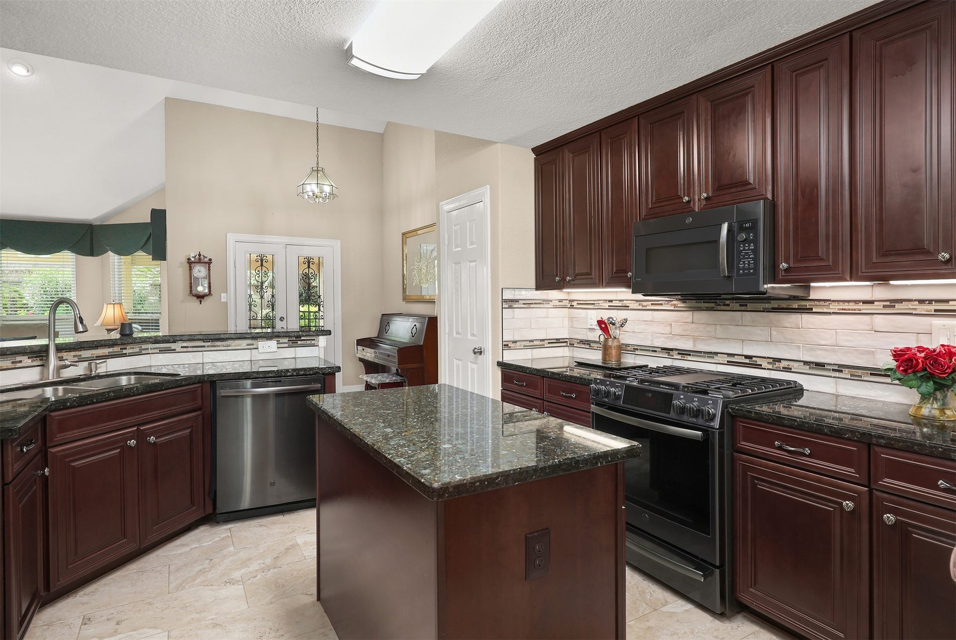 3424 Glastonbury Drive, Pearland, TX 77581 Open kitchen featuring modern stainless steel appliances and access to the backyard oasis.
