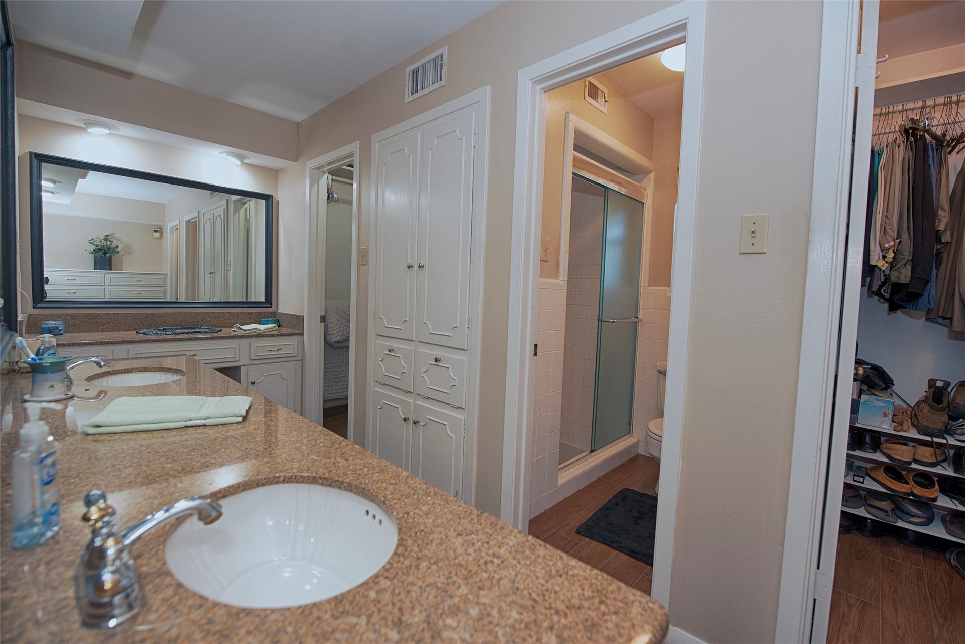 18502 Vinland Drive, Nassau Bay, TX 77058 En suite bathroom with updated double sinks and double walk in closets and fabulous storage.