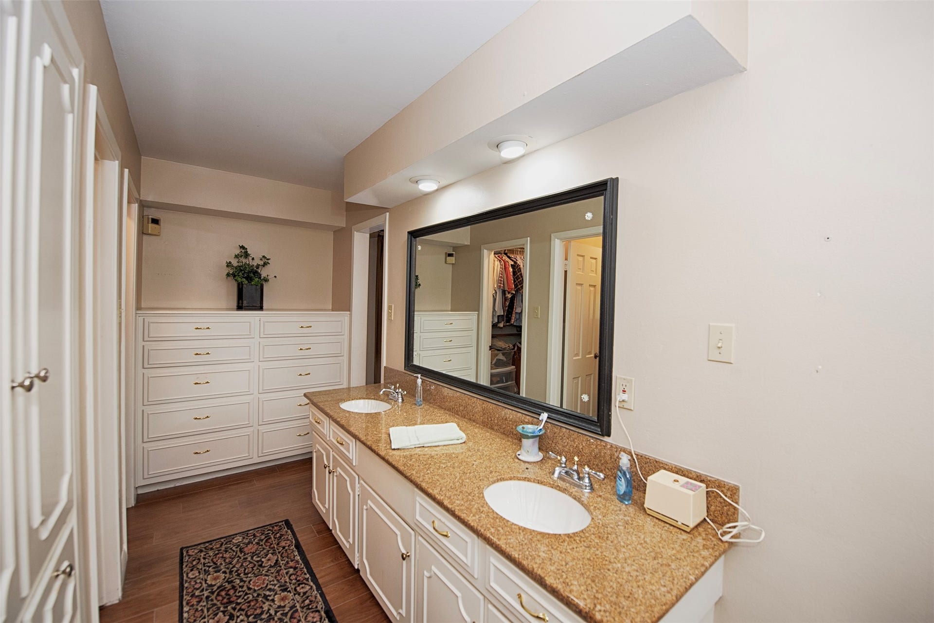 18502 Vinland Drive, Nassau Bay, TX 77058 A view of the double vanity to the built in storage for your clothes.