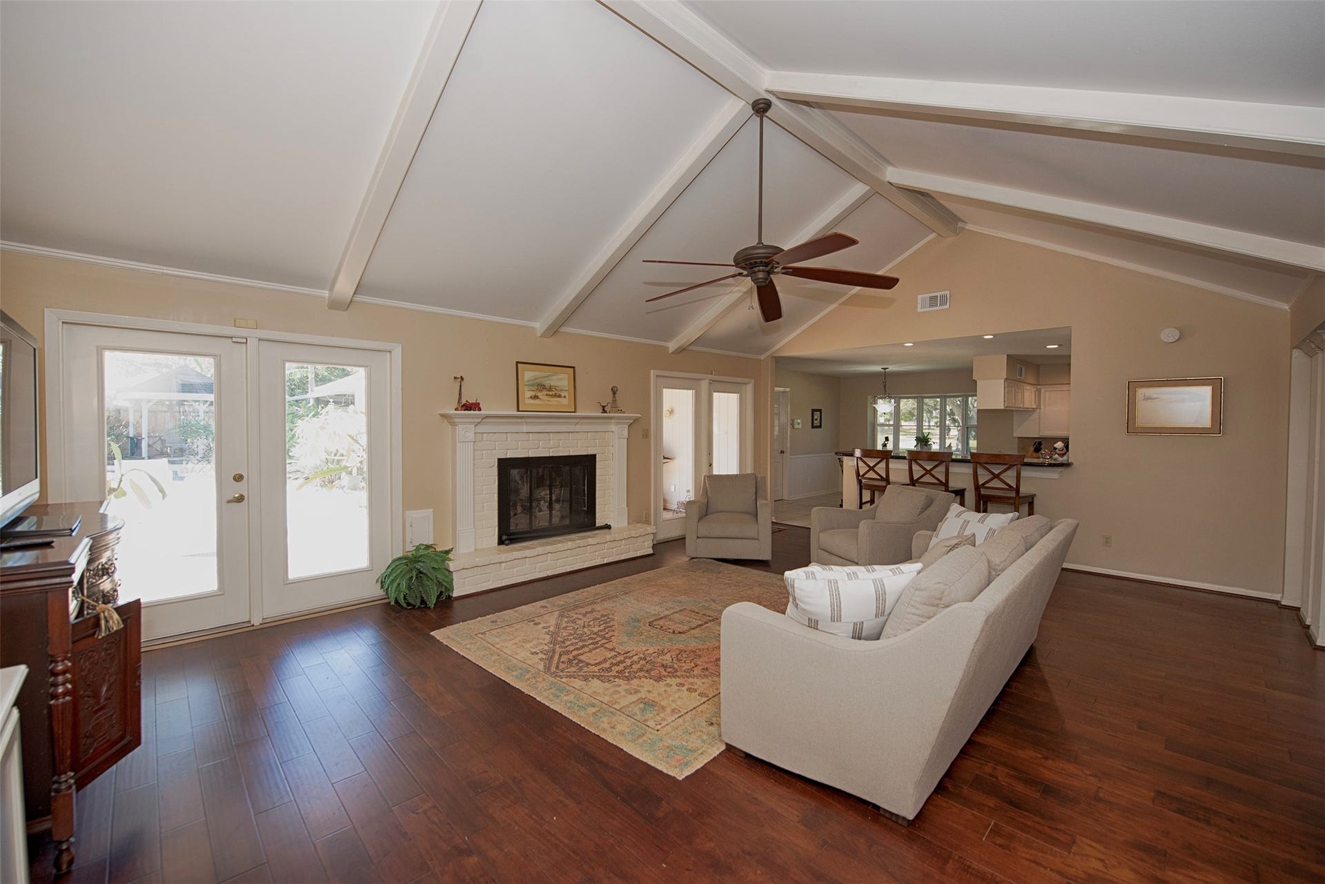 18502 Vinland Drive, Nassau Bay, TX 77058 Incredible family room with fabulous space open to the kitchen with the gorgeous updated wood floors.