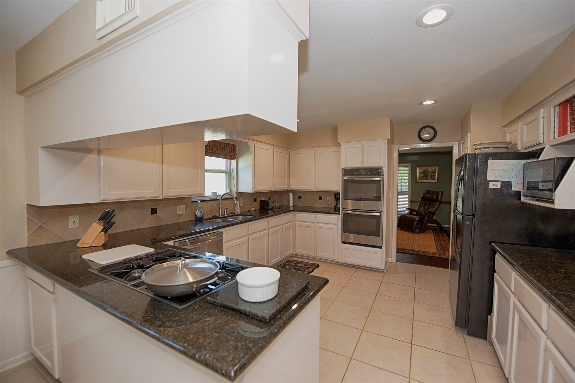 18502 Vinland Drive, Nassau Bay, TX 77058 A view at the end of the kitchen showing access to the den which opens to the formal dining room.