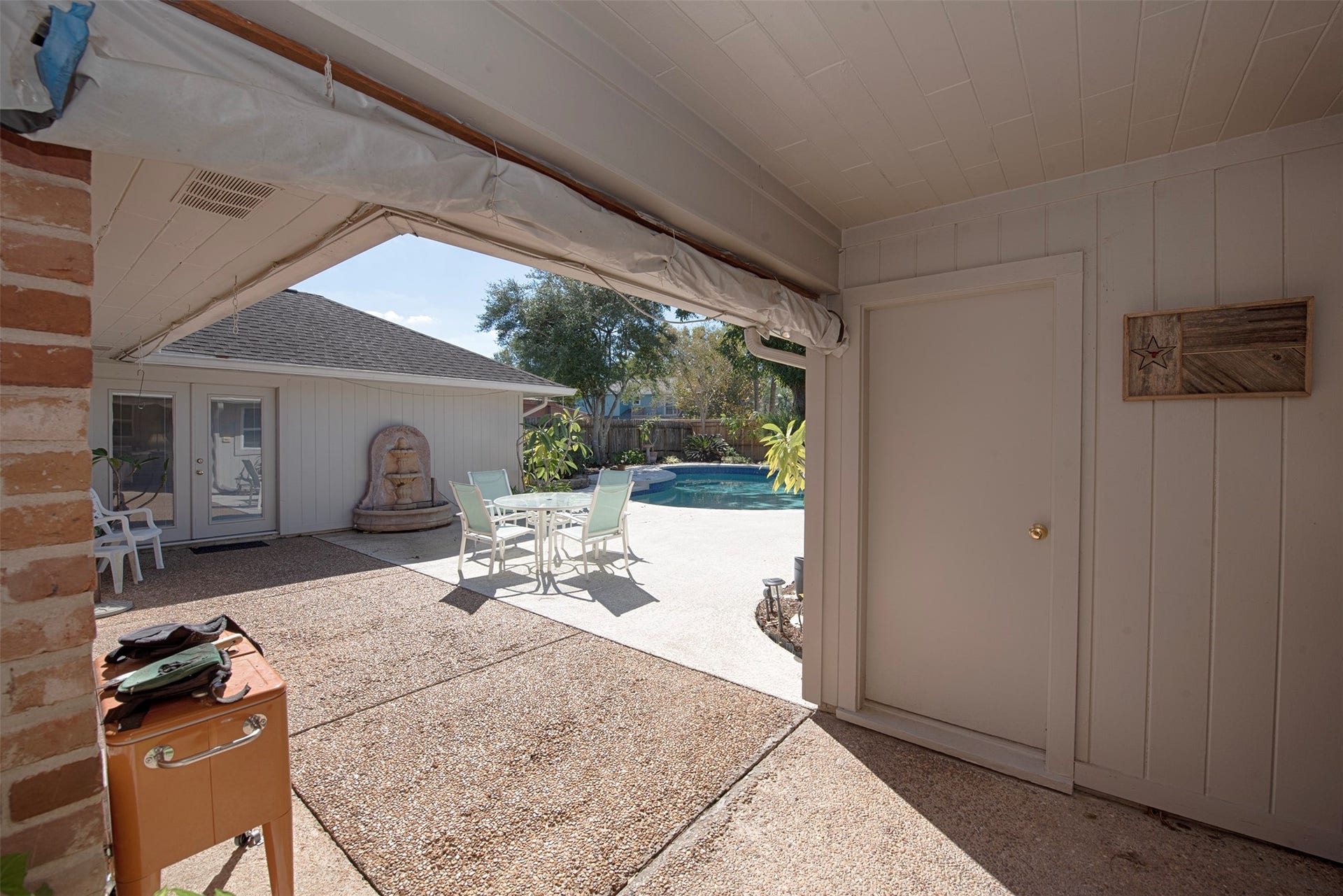 18502 Vinland Drive, Nassau Bay, TX 77058 Out the backdoor is access to the patio and pool. There is even another half bath poolside.