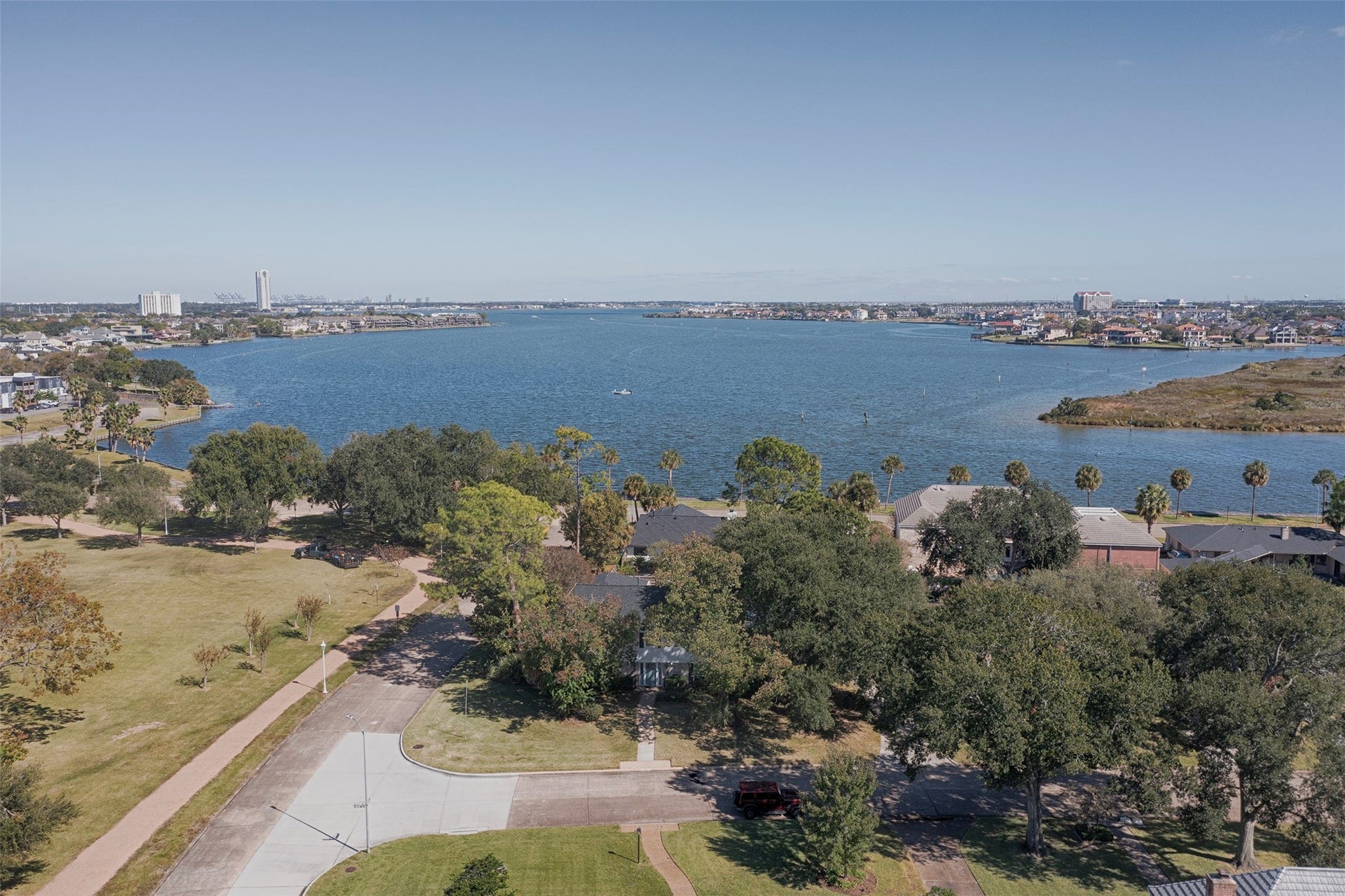 18502 Vinland Drive, Nassau Bay, TX 77058 A view of the gorgeous lake from above the home showing the short distance to the lake and boardwalk.
