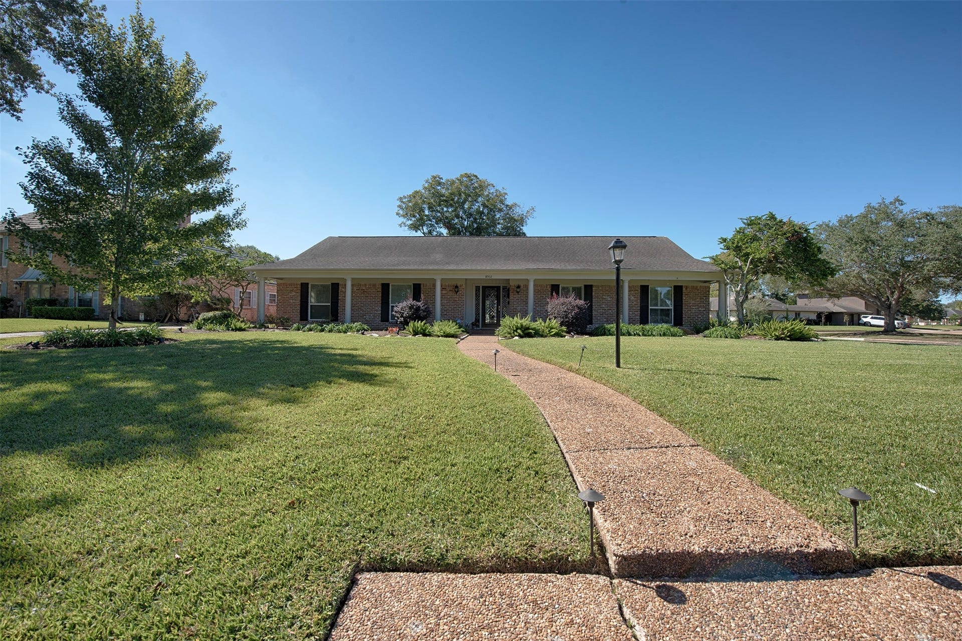 18502 Vinland Drive, Nassau Bay, TX 77058 A view from the street showing the walkway to the front of your new home. Very inviting for your guests.