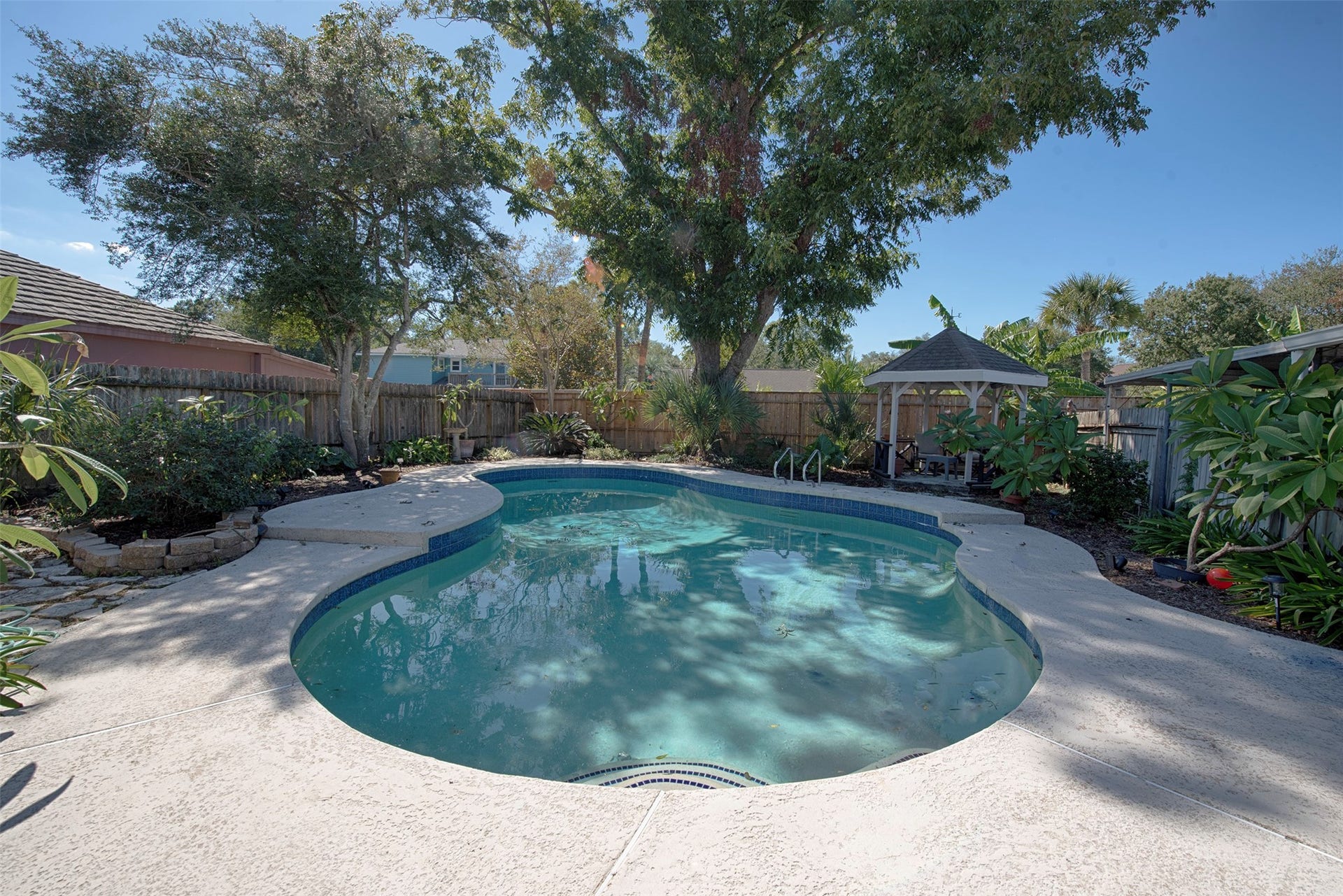 18502 Vinland Drive, Nassau Bay, TX 77058 A view of the gorgeous pool with wonderful landscaping and amazing privacy.