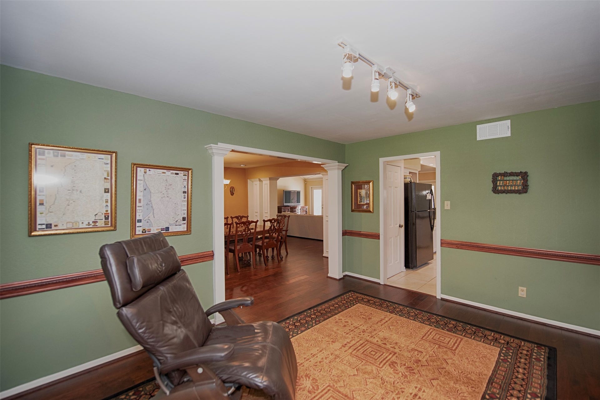 18502 Vinland Drive, Nassau Bay, TX 77058 A view of the den with easy access to the kitchen as well as the formal dining room. This room might also be a great game room or even an office.