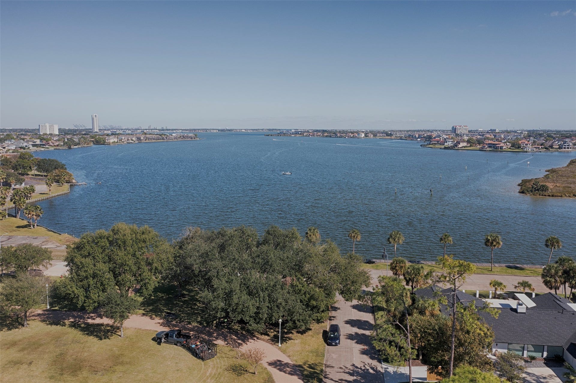 18502 Vinland Drive, Nassau Bay, TX 77058 A view from the park of the gorgeous lake steps away from your new home.