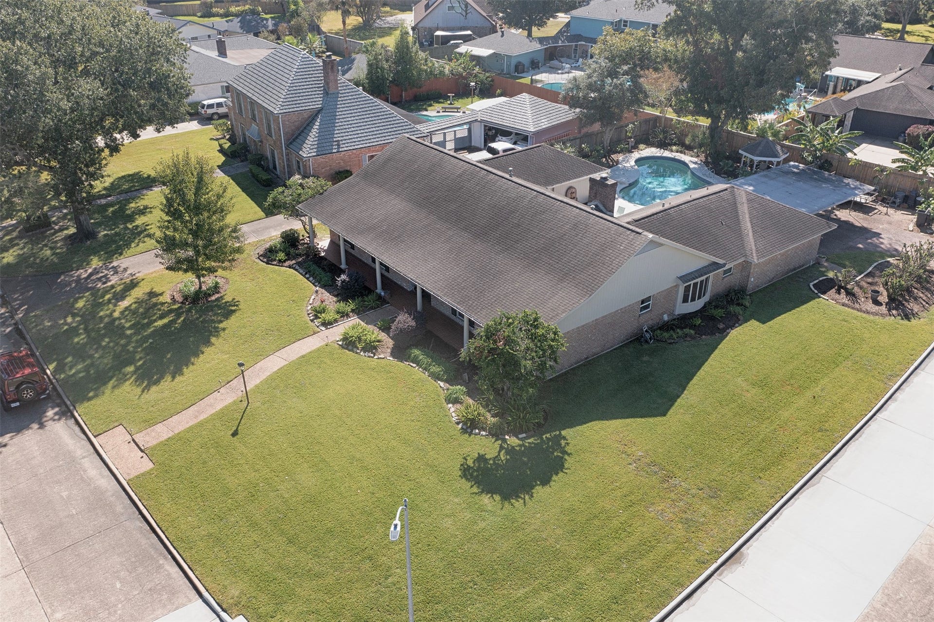 18502 Vinland Drive, Nassau Bay, TX 77058 An aerial view of the home showing the huge lot and the backyard pool.