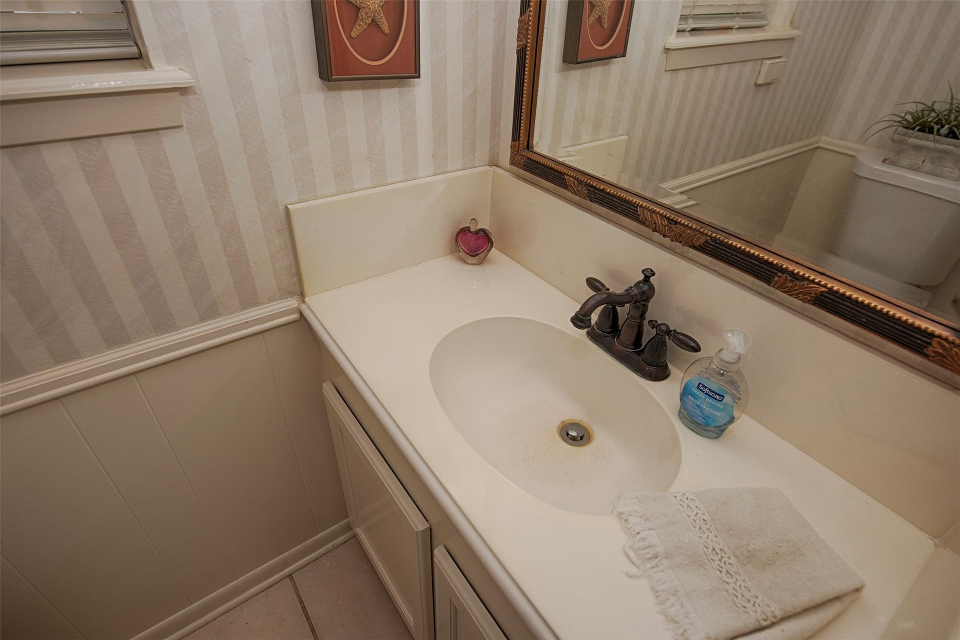 18502 Vinland Drive, Nassau Bay, TX 77058 There is a half bath by the utility room for guests to use when entertaining.