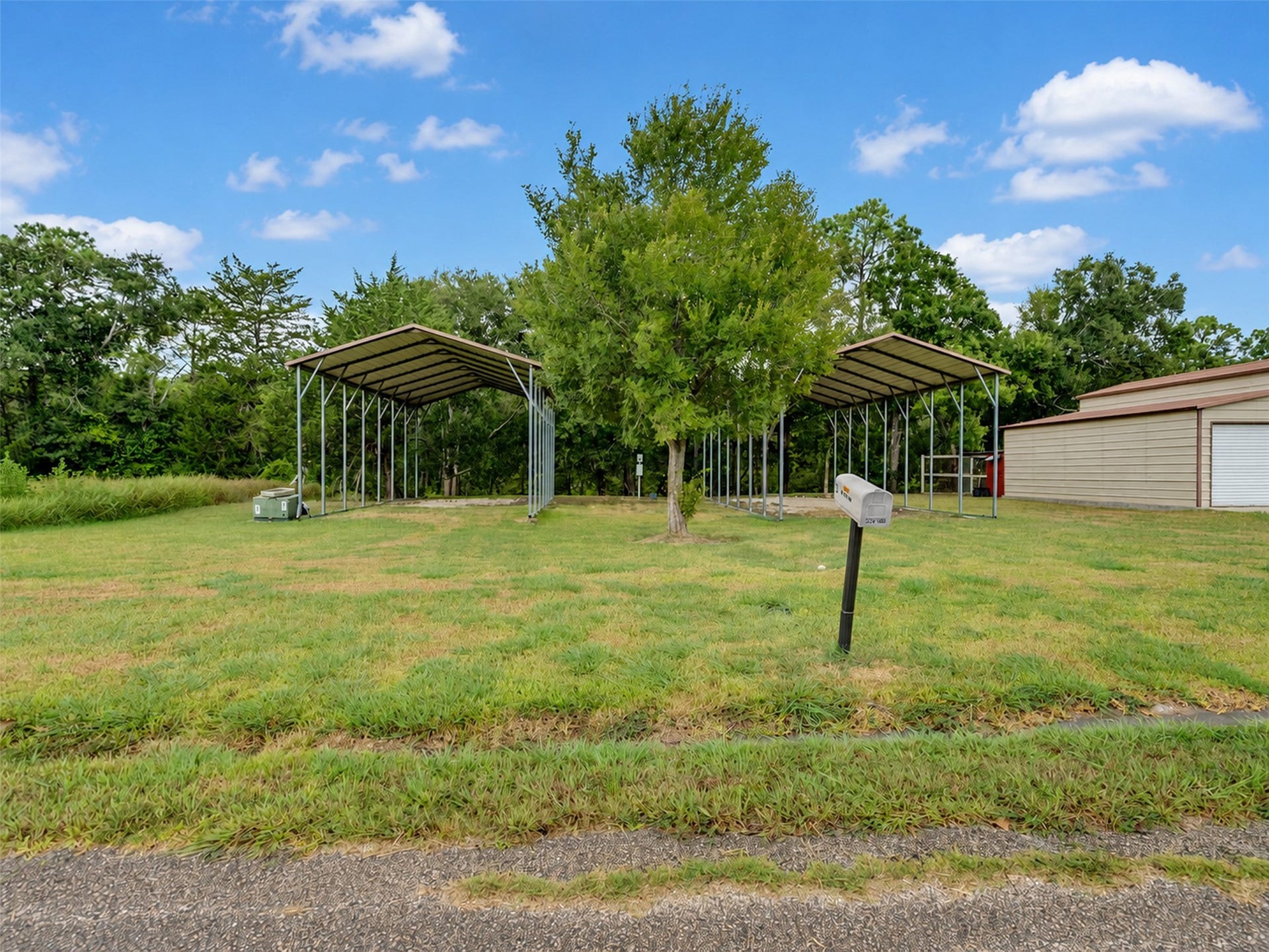 52 County Road 302, Alvin, TX 77511 2- RV covers 35x18
with electric water, 50 and 30 amp hook ups