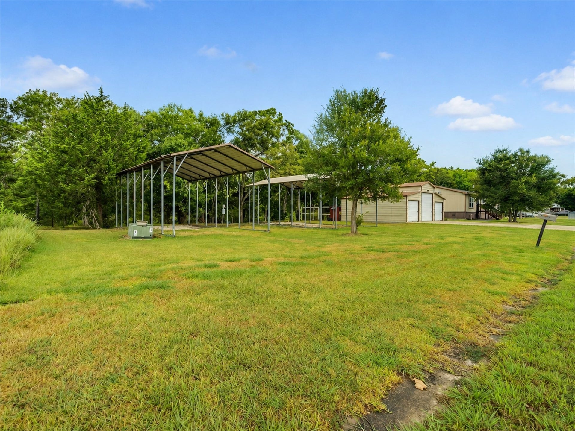 52 County Road 302, Alvin, TX 77511 2- RV covers 35x18
with electric water, 50 and 30 amp hook ups