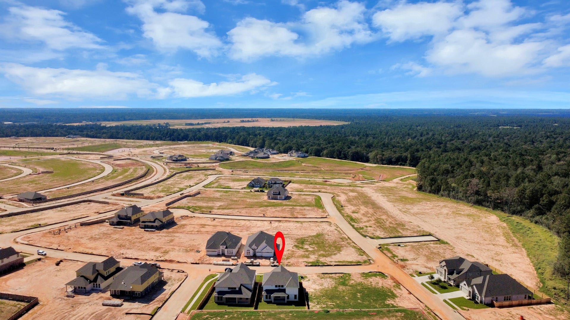 2056 Thimbleberry Lane, Magnolia, TX 77355 An aerial view of a spacious subdivision lot, highlighting a well-maintained yard and a fully fenced perimeter, offering both privacy and expansive outdoor space.