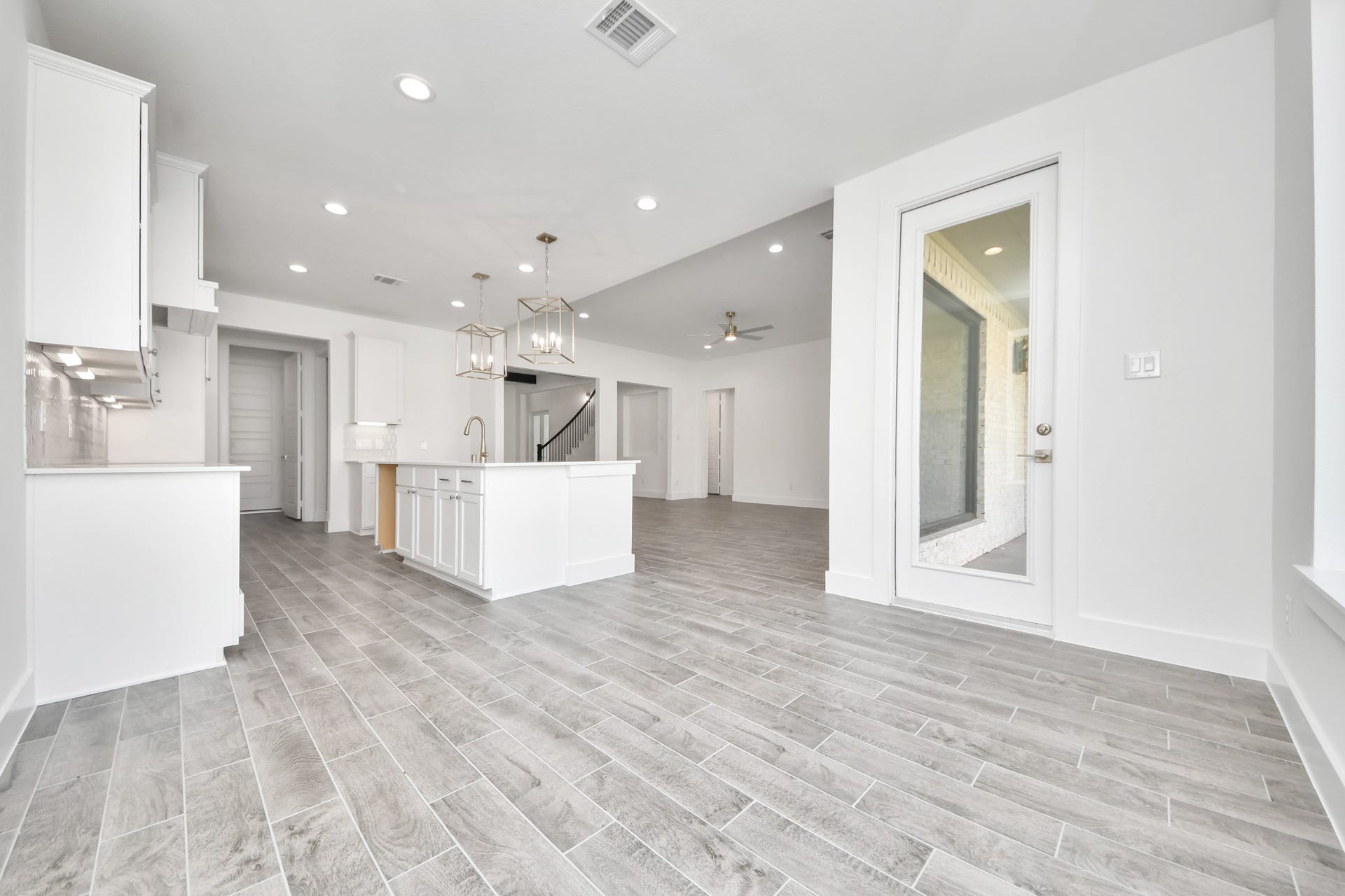 2056 Thimbleberry Lane, Magnolia, TX 77355 Enjoy breakfast with ease in the connected and cozy breakfast area, seamlessly integrated with the kitchen for utmost convenience. Step through the back door for a breath of fresh air onto the covered patio, extending your living space to the outdoors