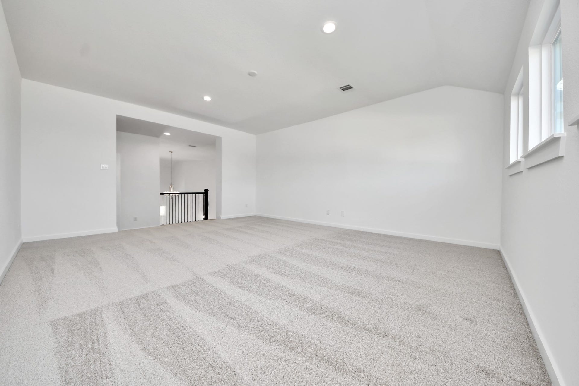 2056 Thimbleberry Lane, Magnolia, TX 77355 Come upstairs and enjoy a day of leisure in this fabulous game room! This is the perfect hangout spot or adult game room! Features plush carpet, high ceilings, custom paint and windows for plenty of natural light.