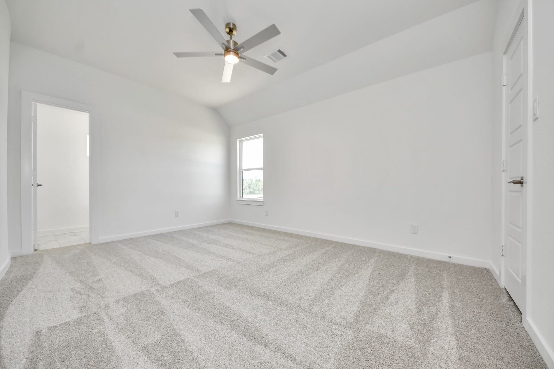 2056 Thimbleberry Lane, Magnolia, TX 77355 Generously sized secondary bedrooms featuring spacious closets, soft and inviting carpeting underfoot, large windows allowing plenty of natural light, and the added touch of privacy blinds for your personal retreat.