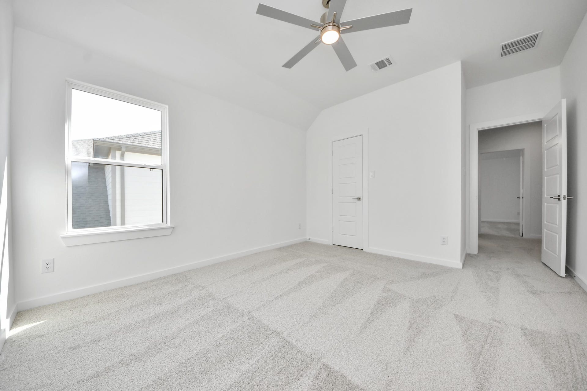 2056 Thimbleberry Lane, Magnolia, TX 77355 Secondary bedroom features plush carpeting, large windows that let in plenty of natural light, bright paint, and spacious closets.