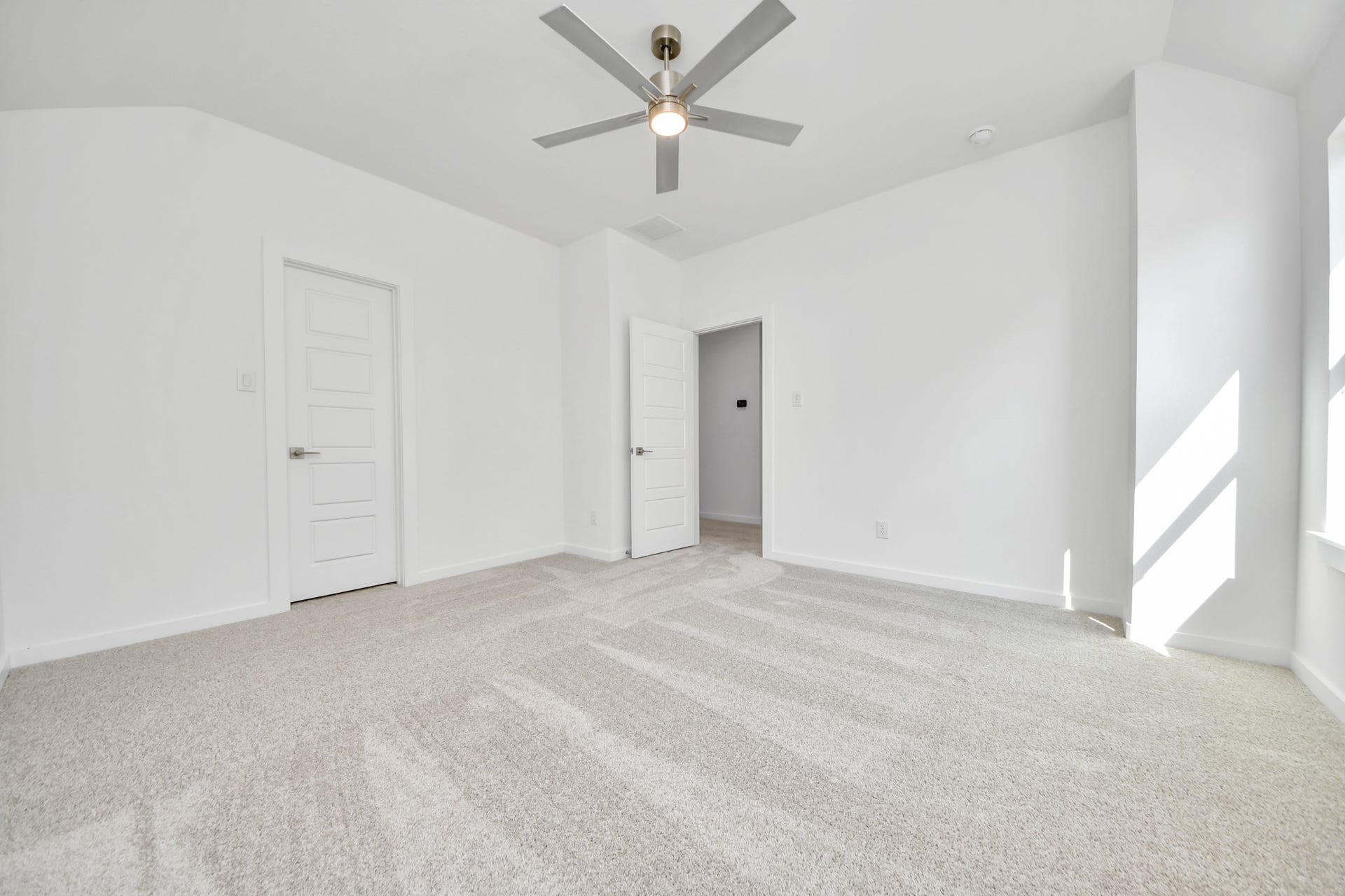 2056 Thimbleberry Lane, Magnolia, TX 77355 Generously sized secondary bedrooms featuring spacious closets, soft and inviting carpeting underfoot, large windows allowing plenty of natural light, and the added touch of privacy blinds for your personal retreat.