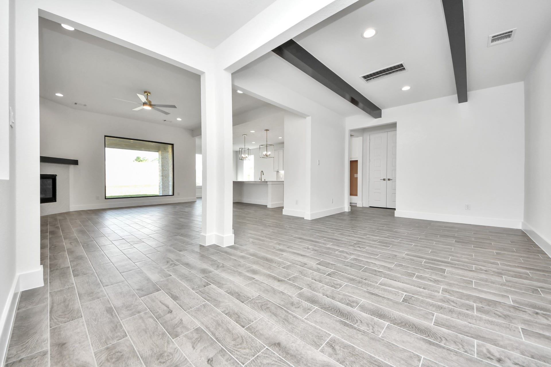 2056 Thimbleberry Lane, Magnolia, TX 77355 Make memories gathered around the table with your family and friends! This spacious dining room features elegant flooring, custom paint, and adjacent to family room and kitchen for open concept feel.