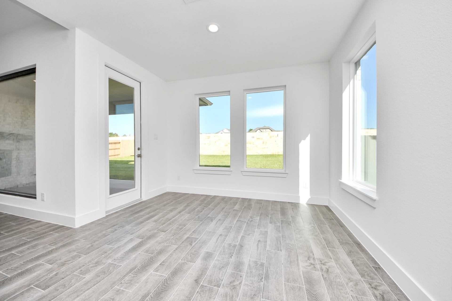 2056 Thimbleberry Lane, Magnolia, TX 77355 Enjoy breakfast with ease in the connected and cozy breakfast area, seamlessly integrated with the kitchen for utmost convenience. Step through the back door for a breath of fresh air onto the covered patio, extending your living space to the outdoors