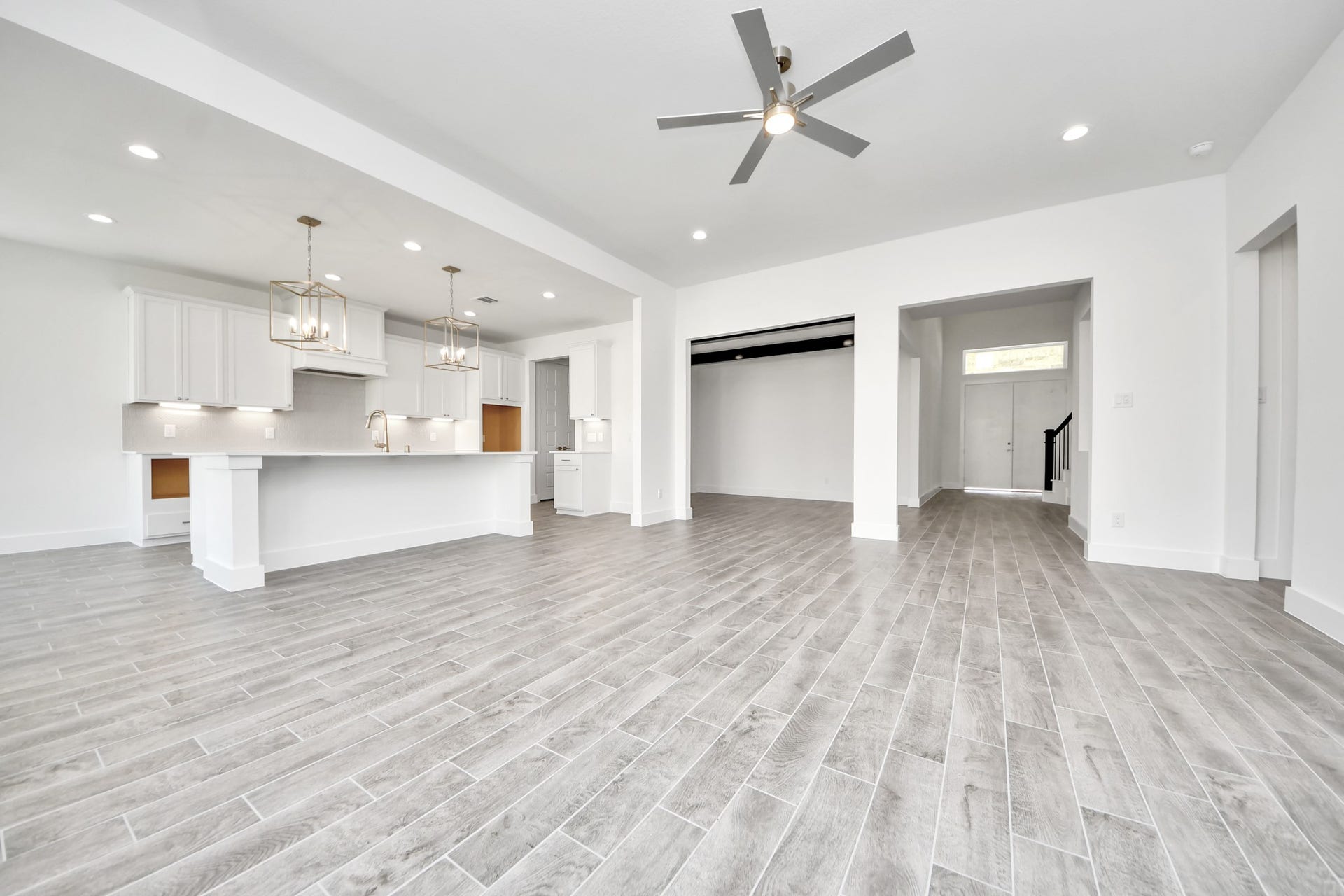 2056 Thimbleberry Lane, Magnolia, TX 77355 Gather the family and guests together in your lovely living room! Featuring soaring high ceilings, recessed lighting, ceiling fan, custom paint, gorgeous floors, and large windows that provide plenty of natural lighting throughout the day.