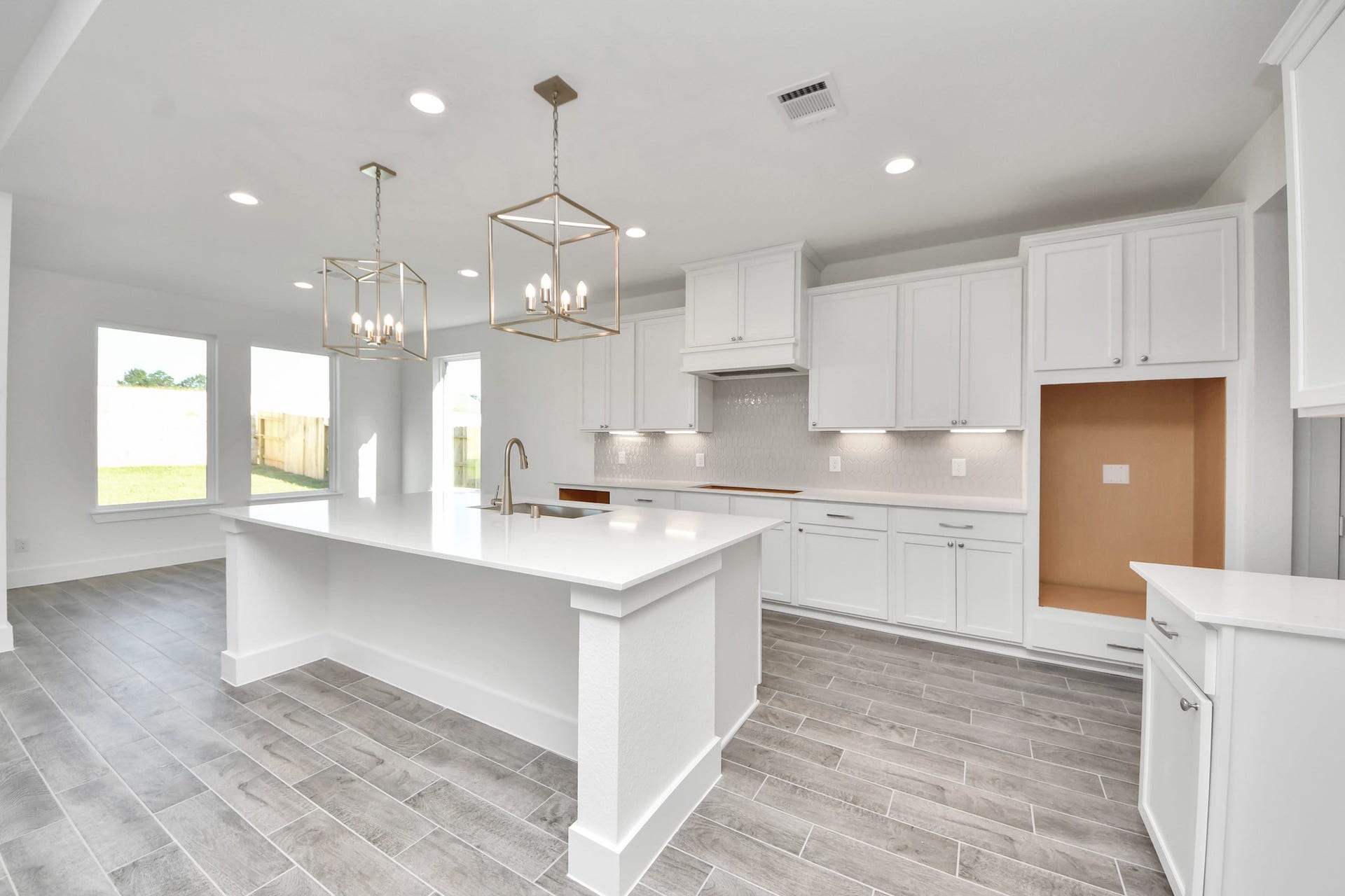 2056 Thimbleberry Lane, Magnolia, TX 77355 The kitchen is a culinary haven, featuring granite countertops, a tile backsplash, stainless steel appliances, 42 upper cabinets, and undercabinet lighting.