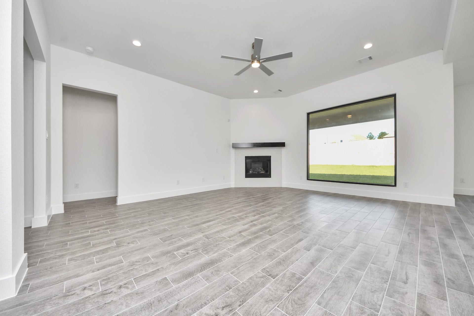 2056 Thimbleberry Lane, Magnolia, TX 77355 Take another glimpse into the heart of the home with this additional view of the family rooma sprawling space ready to accommodate all your gatherings.
