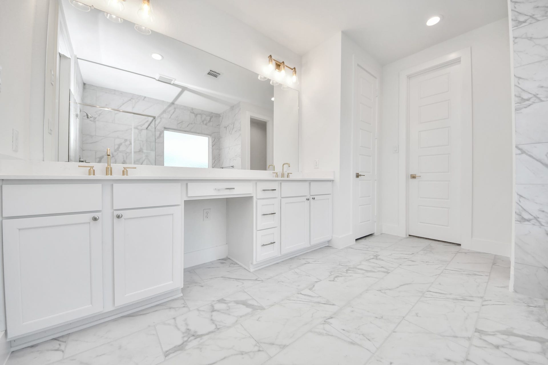 2056 Thimbleberry Lane, Magnolia, TX 77355 Elevate your daily routine at the elegant vanity, now equipped with double sinks, light countertops, modern hardware, and beautiful vanity lights.