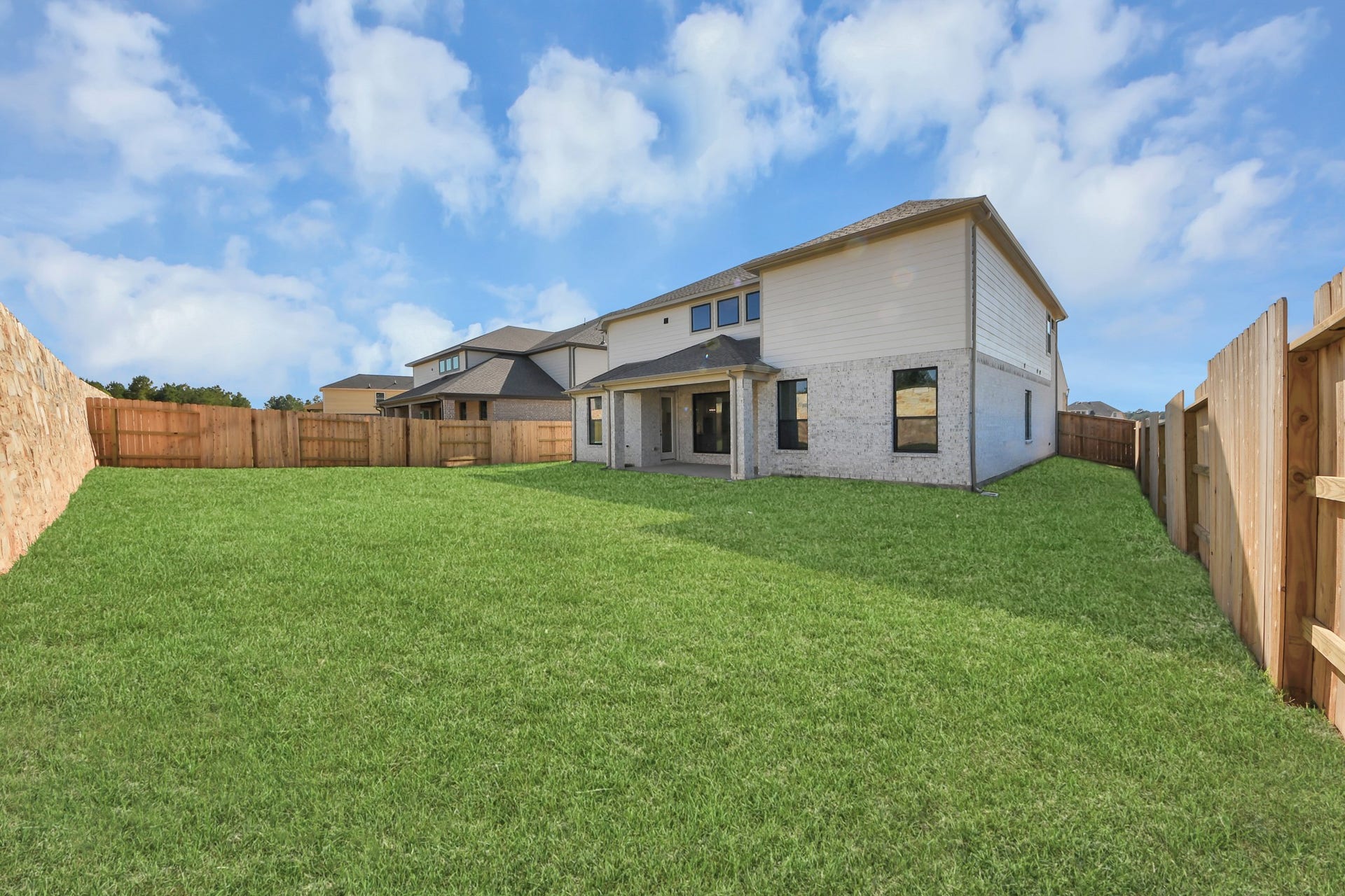 2056 Thimbleberry Lane, Magnolia, TX 77355 Experience outdoor living at its finest on this expansive covered patio, thoughtfully designed for BBQs and delightful outdoor dining.