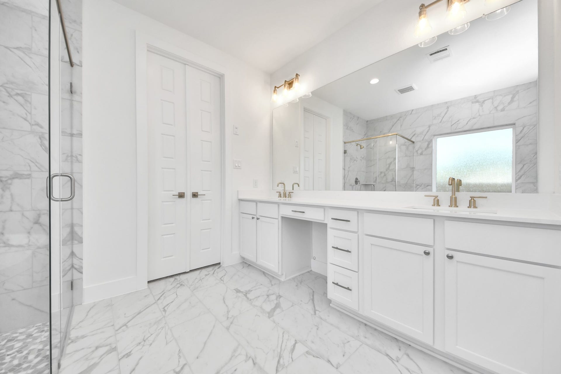 2056 Thimbleberry Lane, Magnolia, TX 77355 Elevate your daily routine at the elegant vanity, now equipped with double sinks, light countertops, modern hardware, and beautiful vanity lights.