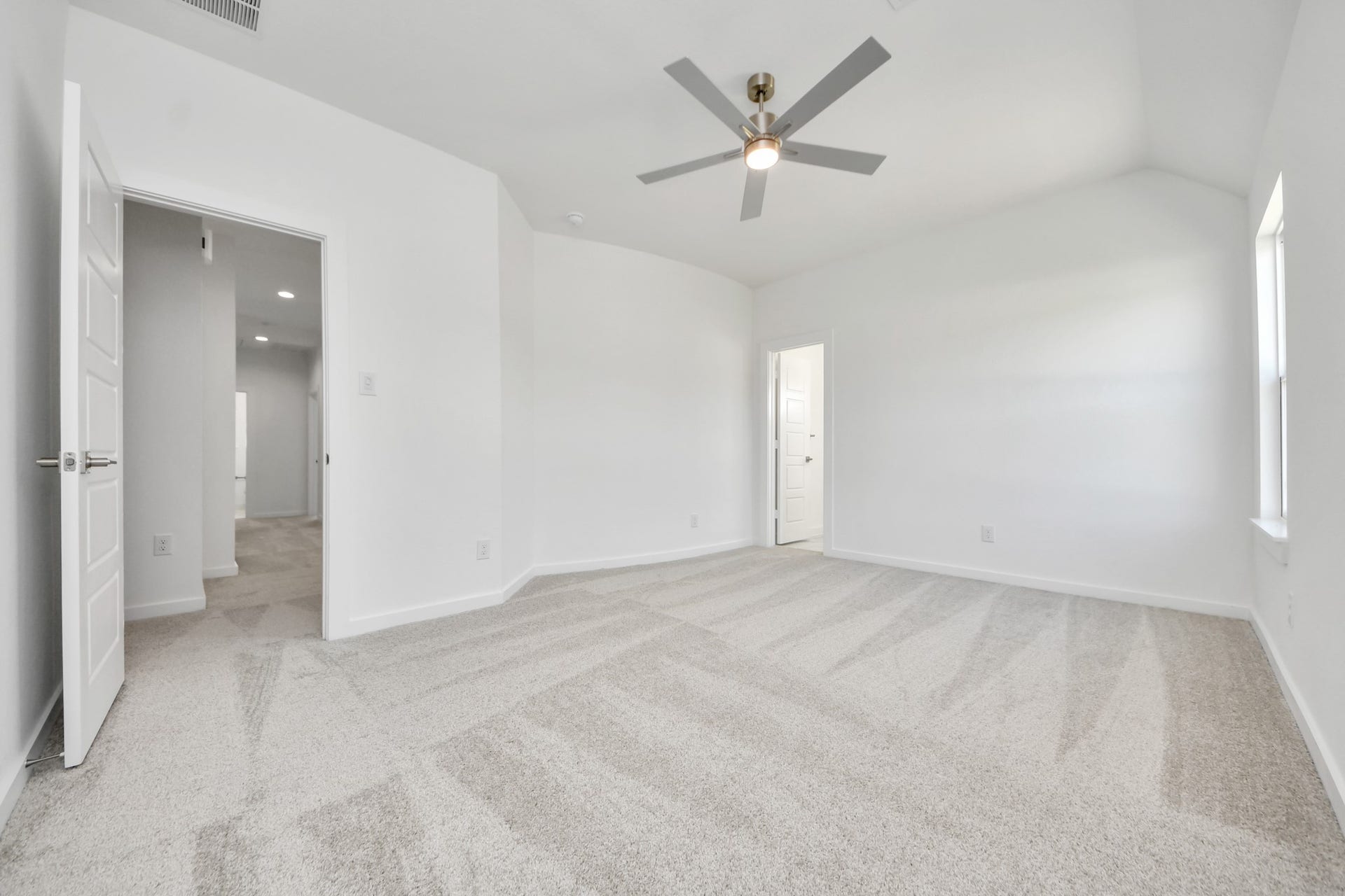 2056 Thimbleberry Lane, Magnolia, TX 77355 Secondary bedroom features plush carpeting, large windows that let in plenty of natural light, bright paint, and spacious closets.