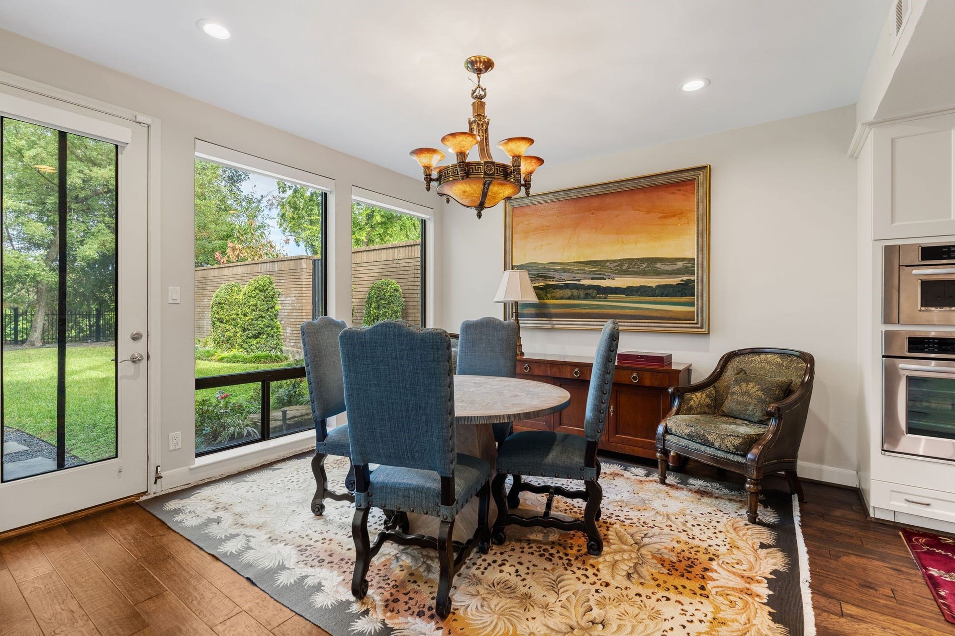 1918 Stoney Brook Drive, Houston, TX 77063 Enjoy morning coffee in the breakfast area, where large windows frame views of the lawn and mature trees.
