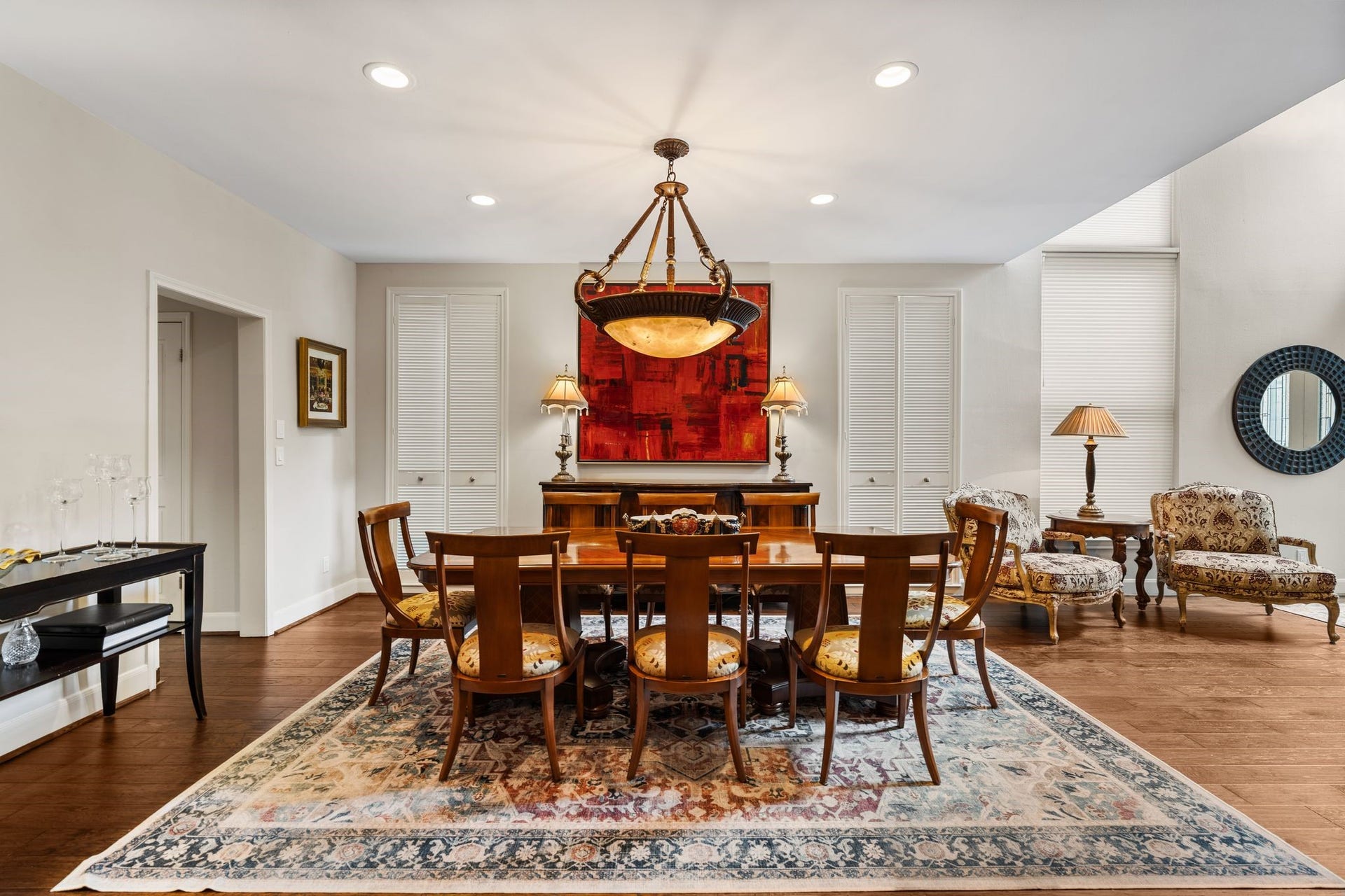 1918 Stoney Brook Drive, Houston, TX 77063 The generous dining area accommodates both a full dining area and an inviting sitting area beside the tall windows.