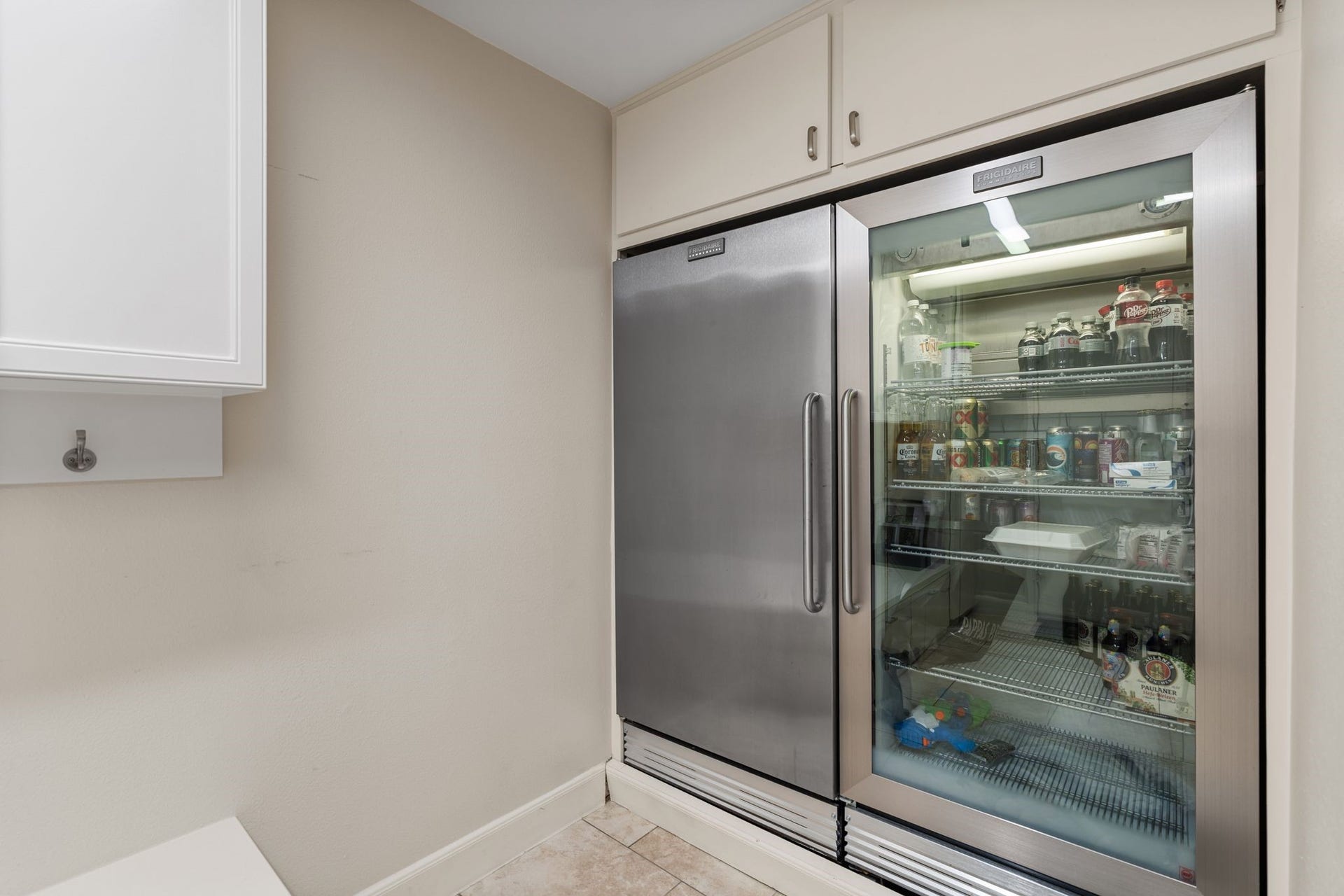 1918 Stoney Brook Drive, Houston, TX 77063 Also in the mud room, additional built-in refrigeration provides convenient storage for beverages and entertaining essentials, with overhead cabinetry adding useful storage space.