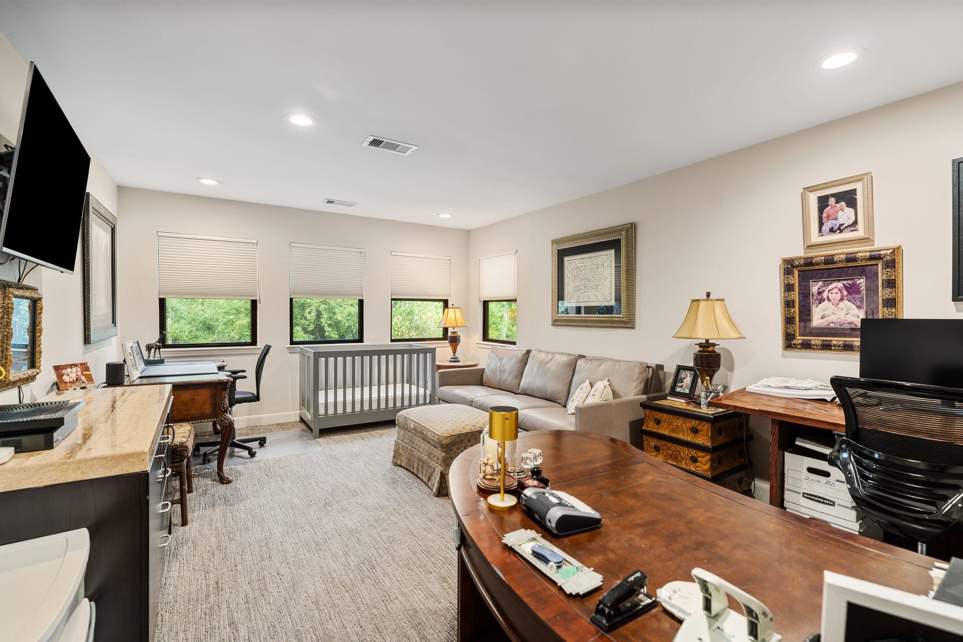 1918 Stoney Brook Drive, Houston, TX 77063 Currently arranged as a home office, this versatile upstairs room offers multiple windows and space for both workstations and comfortable seating.