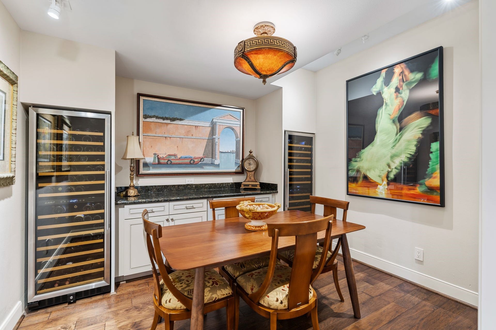 1918 Stoney Brook Drive, Houston, TX 77063 Two tall wine refrigerators, built-in cabinetry and a serving counter create an inviting setting for wine tastings and conversation.