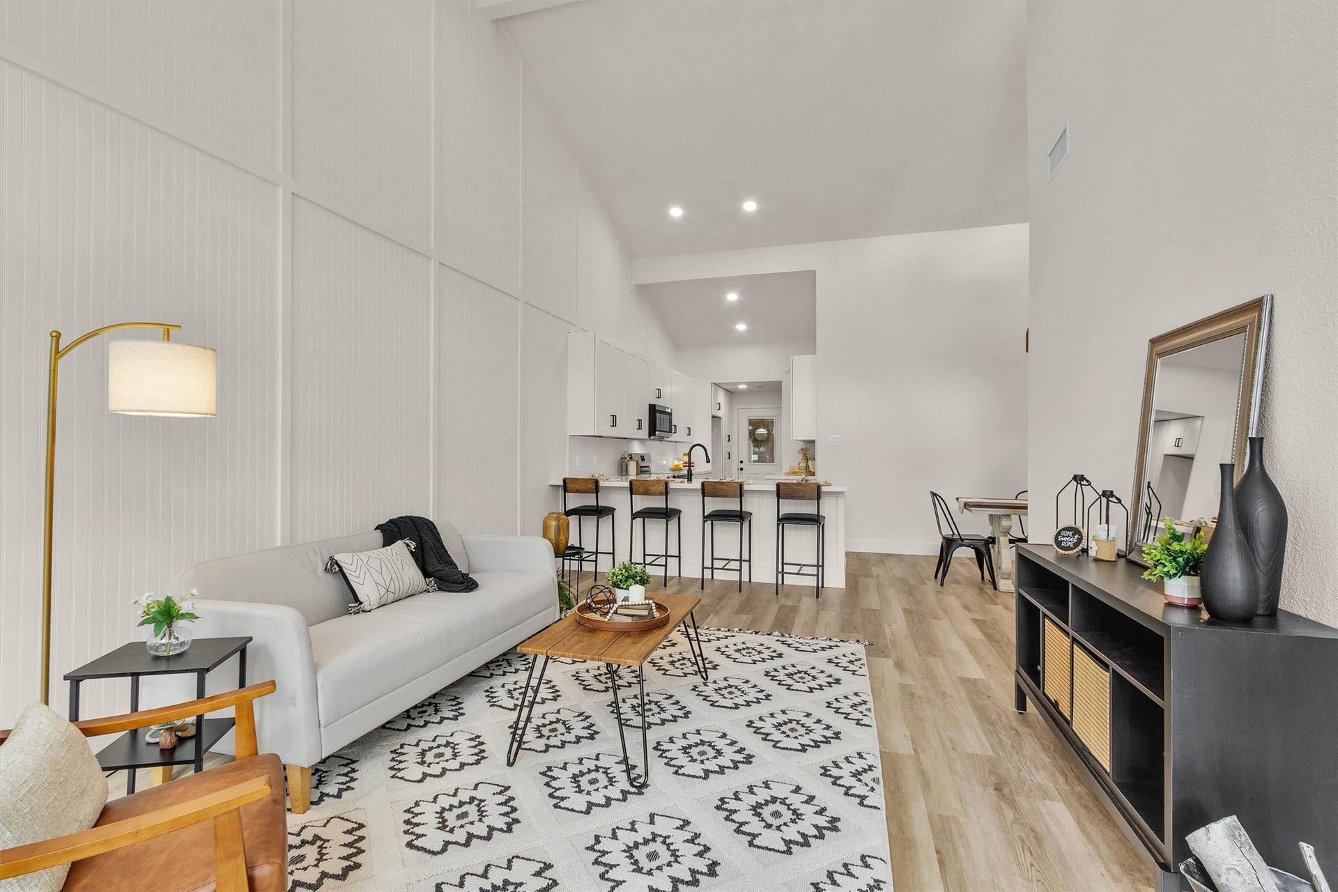 33 April Village, Montgomery, TX 77356 Soaring ceilings and beautiful architectural detailing elevate this spacious living area, while the open-concept design creates an effortless flow into the kitchen and dining spacesperfect for everyday living and entertaining.
