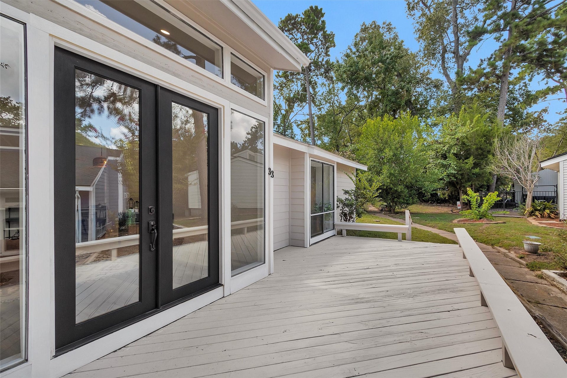 33 April Village, Montgomery, TX 77356 Welcome home in style! A brand-new custom glass front door creates a striking first impression, bringing a sleek modern touch and beautiful natural light to this inviting entry.