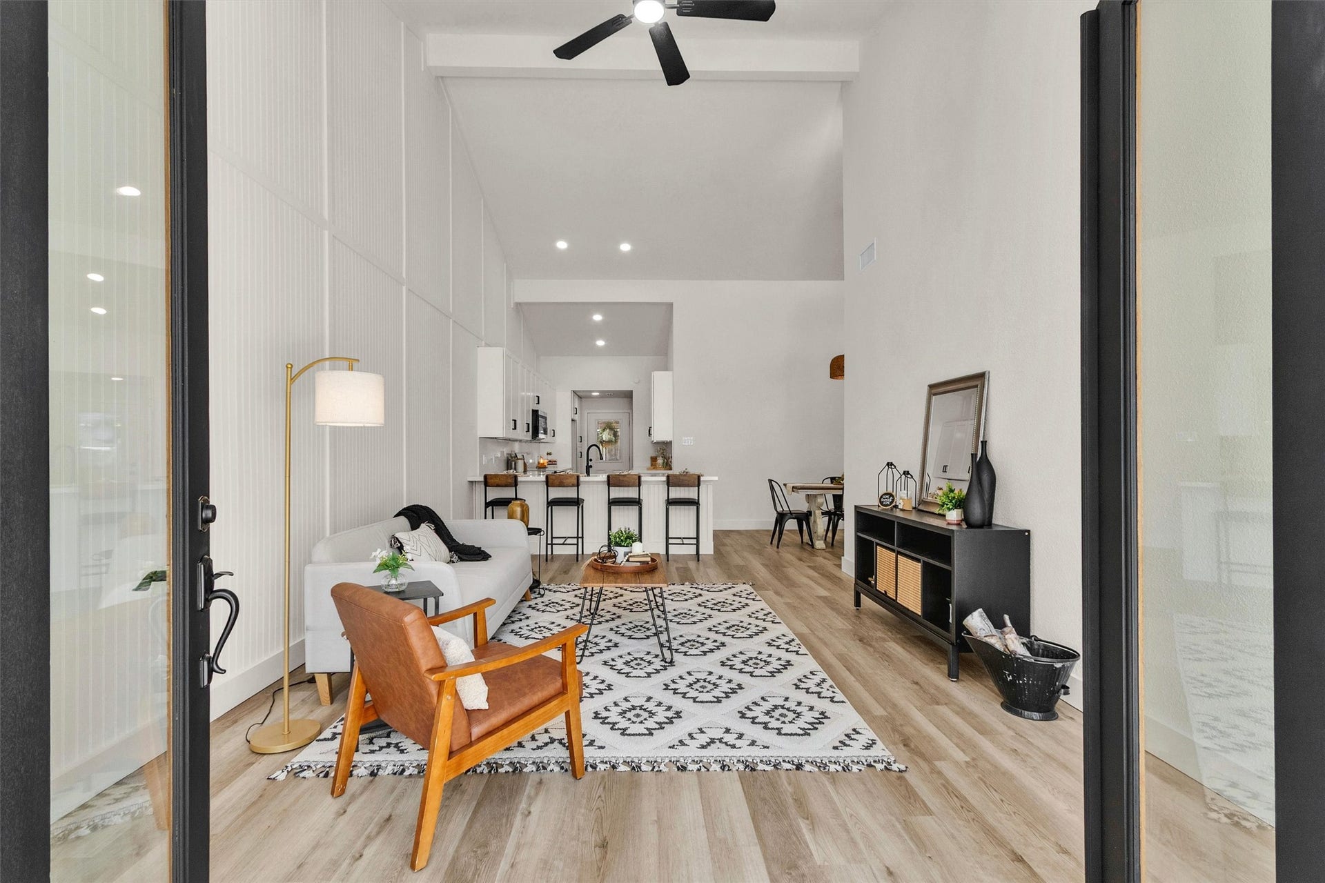 33 April Village, Montgomery, TX 77356 Step inside to a bright, open-concept living space where soaring ceilings, modern finishes and abundant natural light create an impressive first impression with seamless flow into the kitchen and dining areas.