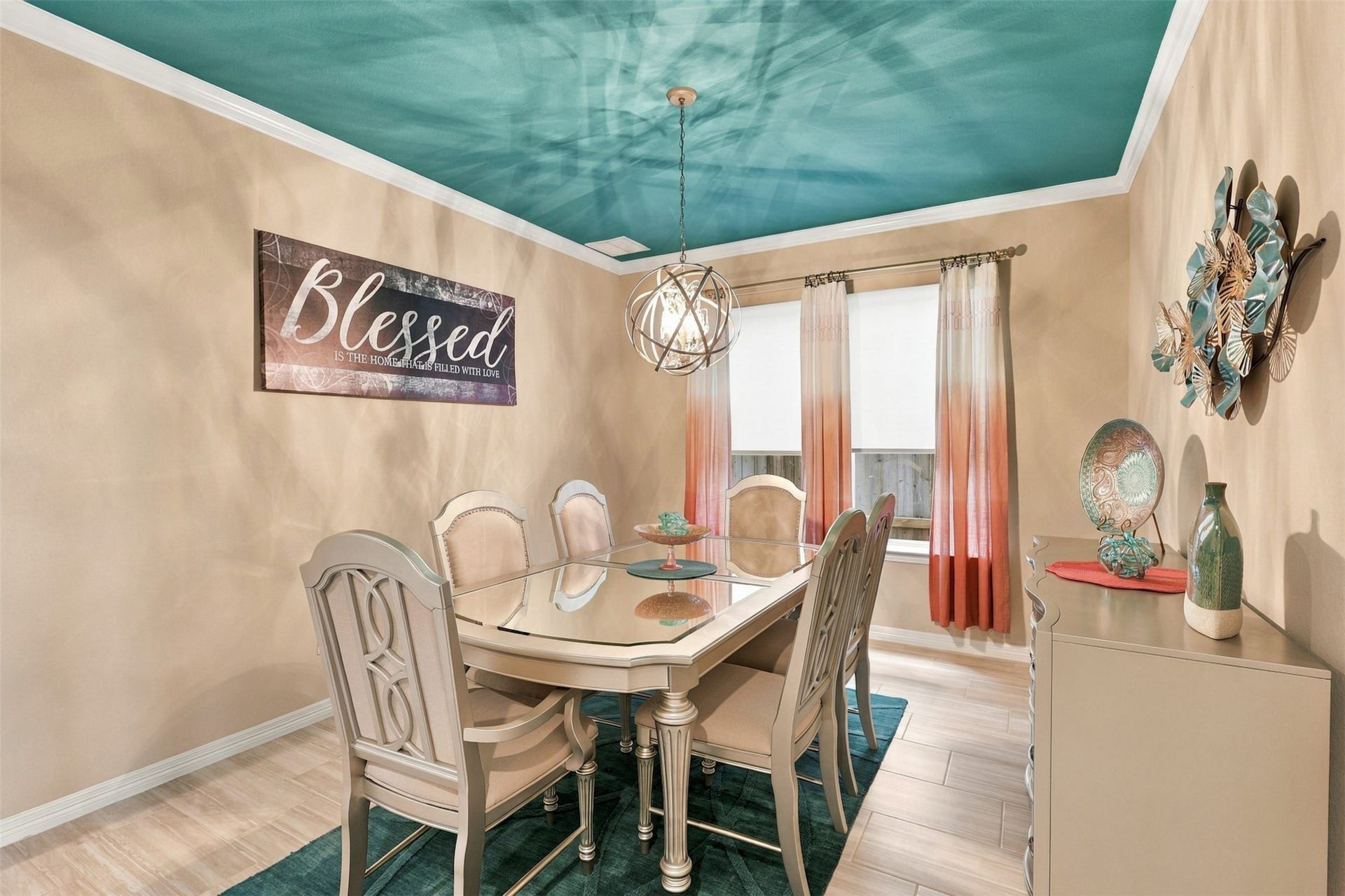 1719 Country Air Lane, Missouri City, TX 77459 ABSOLUTELY BREATHTAKING! This SHOWSTOPPING formal dining room is a masterpiece of elegance, personality, and designer flair! LOOK UP and admire the spectacular custom teal ceiling that creates an unforgettable WOW FACTOR! A dazzling chandelier adds a touch of glamour, while stylish furnishings complete this picture-perfect setting! Imagine hosting elegant dinner parties, unforgettable holiday celebrations, and cherished family gatherings in this extraordinary space!
