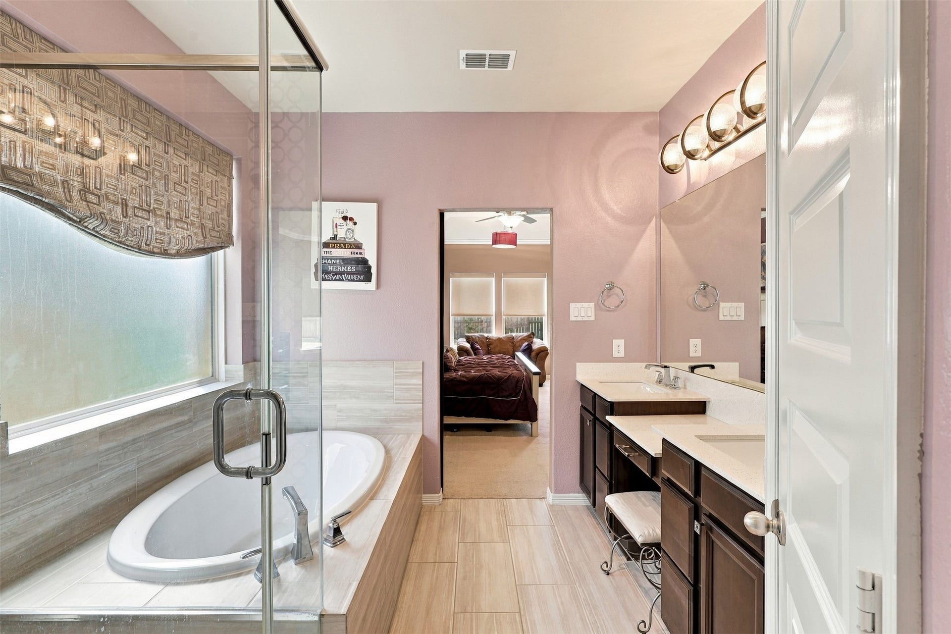 1719 Country Air Lane, Missouri City, TX 77459 WOW! Prepare to FALL IN LOVE with this BREATHTAKING primary bathroom, designed for ultimate relaxation and everyday indulgence! Step into the SPECTACULAR seamless glass walk-in shower, or imagine sinking into the magnificent deep, oversized soaking tub, surrounded by warm bubbles as the stresses of the day simply melt away! Enjoy the convenience of a spacious linen pantry, perfect for keeping plush towels and all your spa essentials beautifully organized!