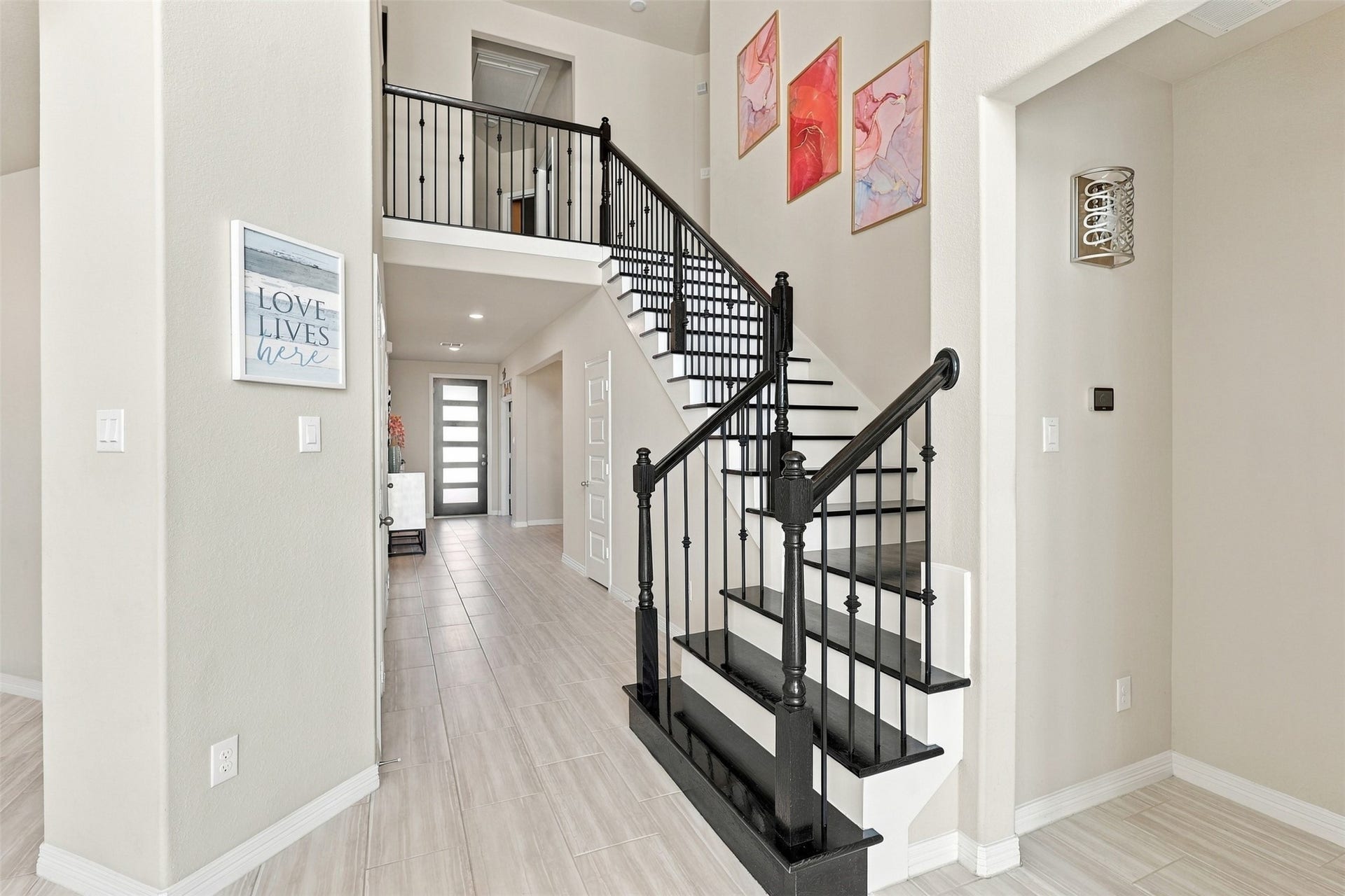 1719 Country Air Lane, Missouri City, TX 77459 LET'S DISCOVER WHAT AWAITS UPSTAIRS! WOW! This BREATHTAKING sweeping staircase is a true architectural SHOWSTOPPER, featuring gorgeous wood steps and elegant decorative iron railings that add timeless beauty and sophistication! As you make your way upstairs, prepare to be AMAZED by even more incredible living spaces, thoughtful design, and wonderful surprises!